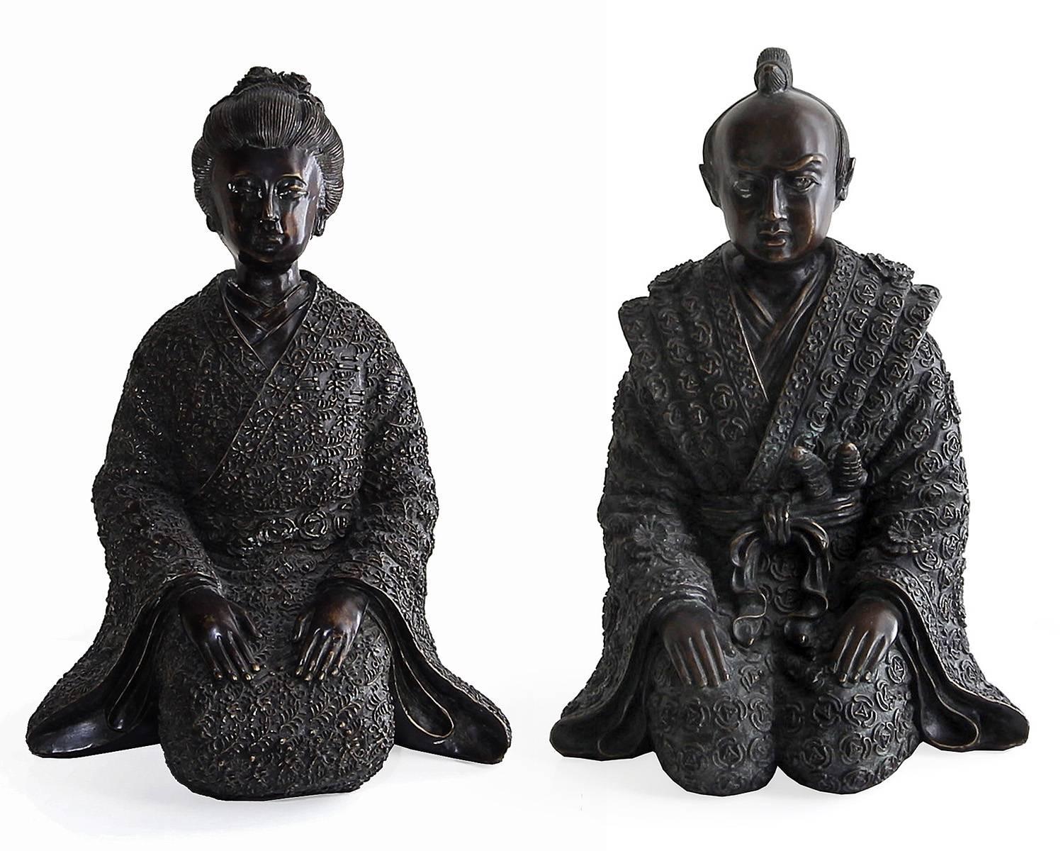 Beautiful pair of Japanese inspired bronze statues by the Maitland-Smith company, circa 1990s. Includes one geisha figure and one samurai, both in a kneeling position. Details on the figures, robes, faces and hair are done in high relief with high