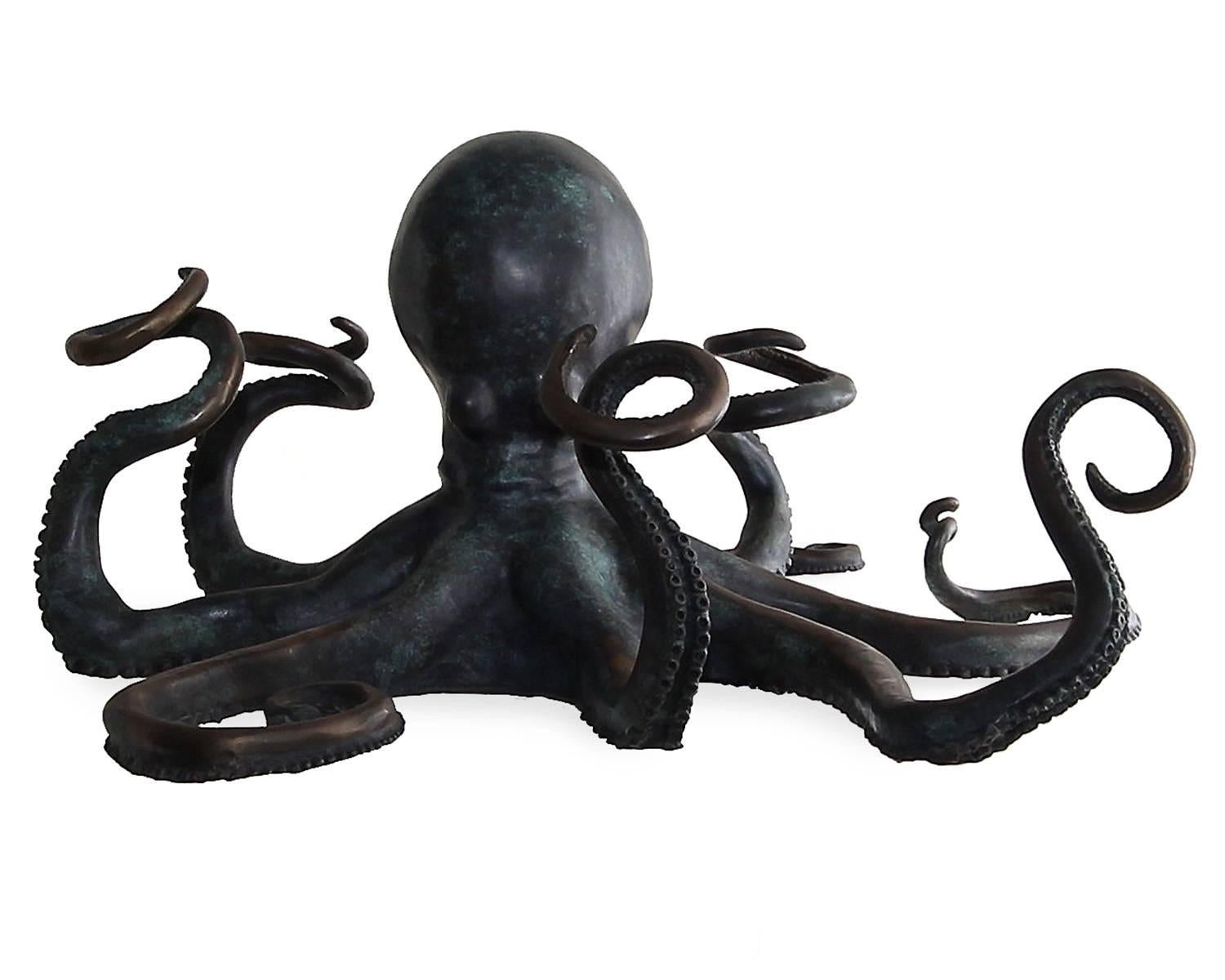 Oversize Maitland-Smith bronze sculpture of an octopus that also serves as a wine bottle holder. The piece can hold four inverted wine bottles in its arms. These are very rare, since they were only produced for a short time and in very limited