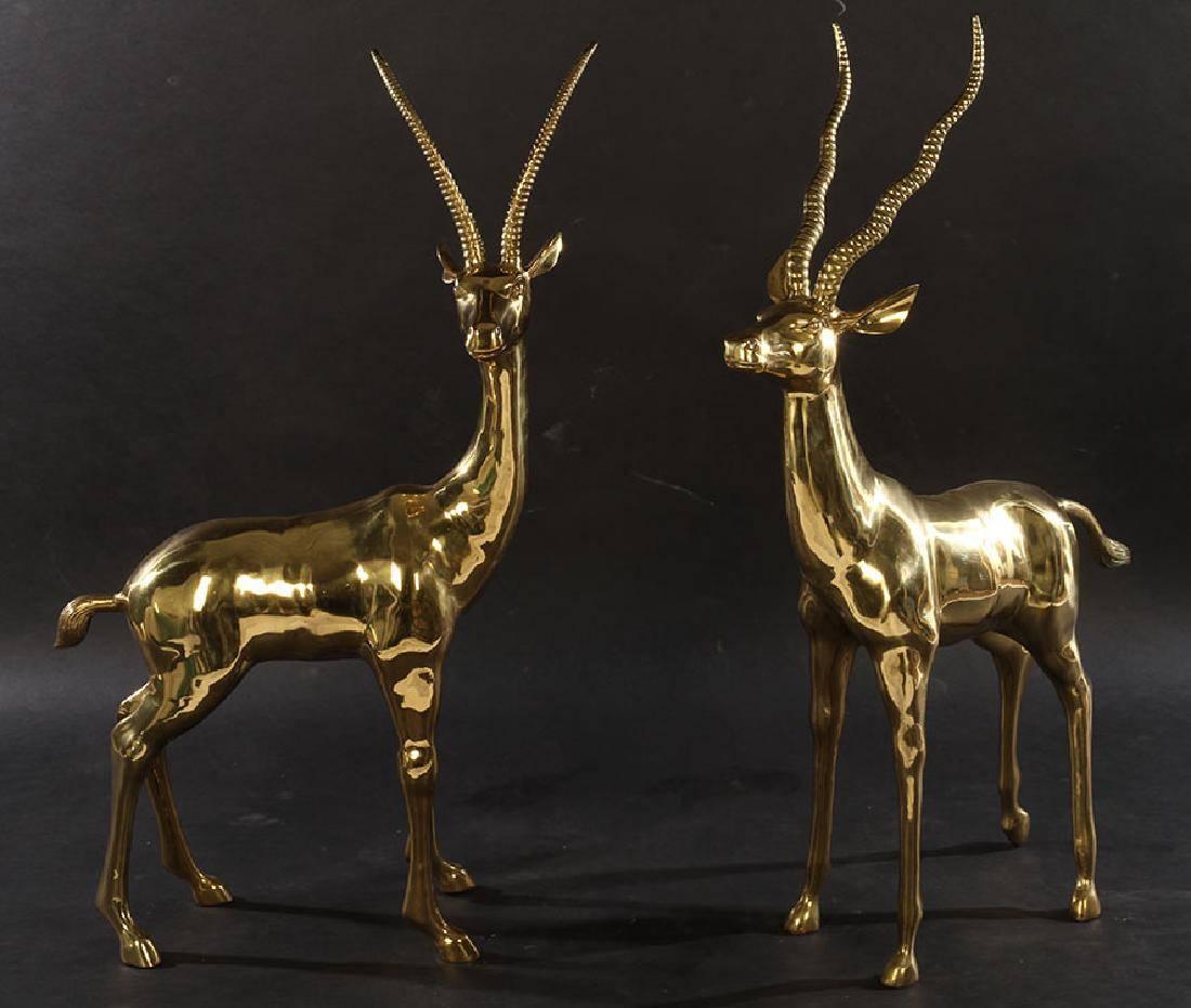 This pair of gazelle statues makes an incredible impression! Created in polished brash and standing nearly 4 feet (46.5 inches) tall, they can be used to complement Mid-Century, tribal or eclectic styles . . . or anywhere else you need a focal
