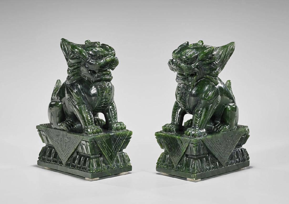 Pair of Chinese Carved Lion Sculptures in Spinach Jade on Lotus Pedestal In Good Condition For Sale In Houston, TX