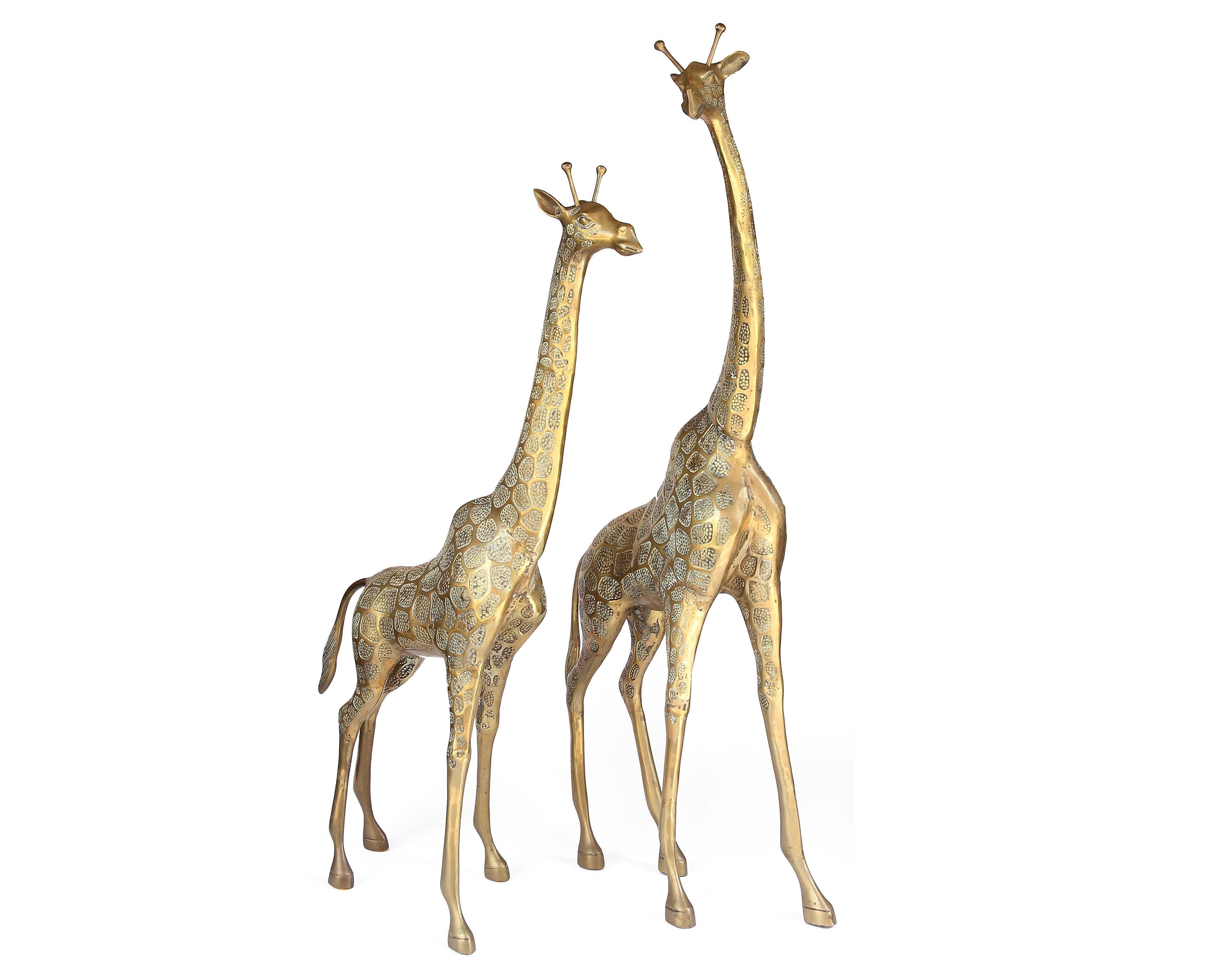 This beautifully detailed pair of brass giraffes add a touch of Hollywood Regency style to any space. As you can see from the photos, these pieces were cast in Fine detail and with expert craftsmanship. The giraffes have a beautiful vintage brass