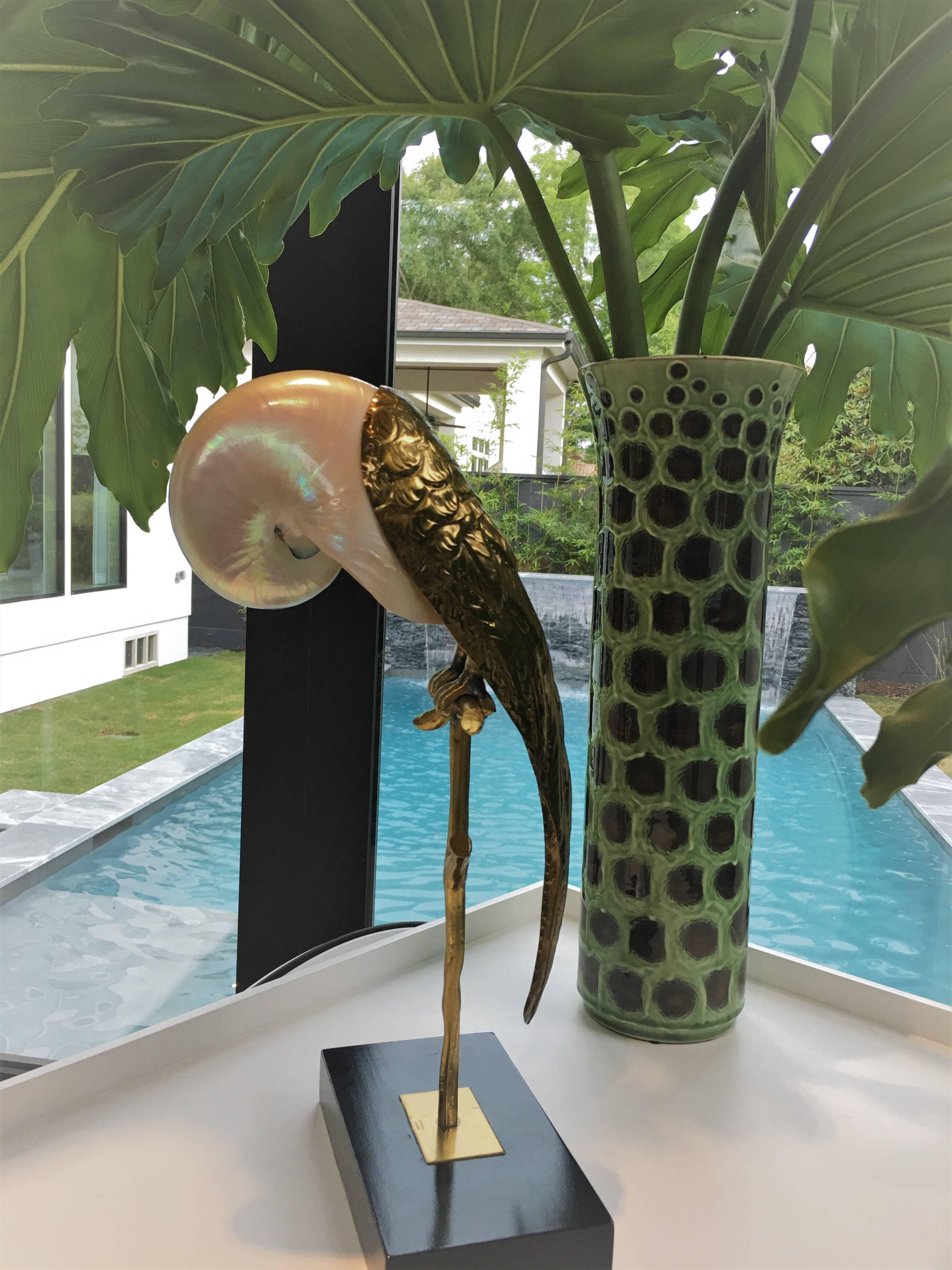 Whimsical Mid-Century parrot sculpture crafted with brass and a gorgeous shell used here as the head. This is an unusual specimen for Binazzi, as the shells are typically used for the bodies of these fanciful creations. The size of this example is