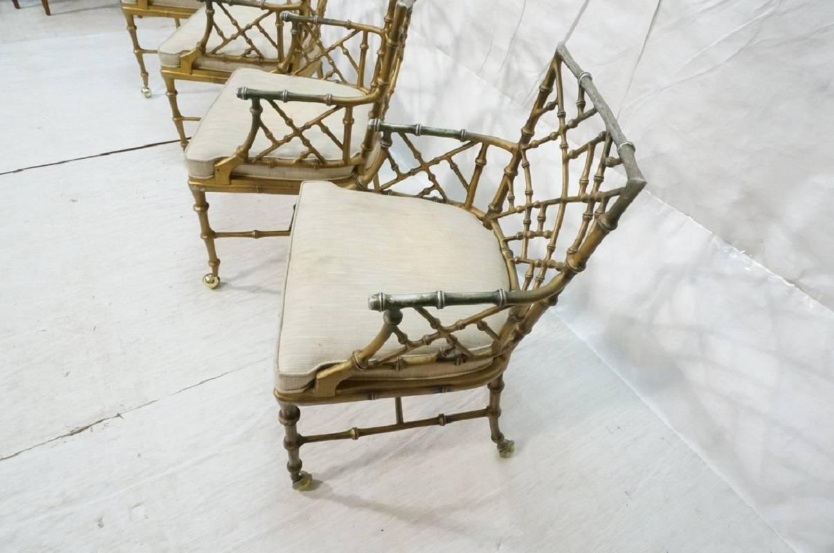 Here is a very nice matched set of four cast metal 'bamboo' style armchairs designed by Phyllis Morris, perfect for indoors or out. The original gold wash finish is worn so powder coating is recommended. We have not undertaken restoration because