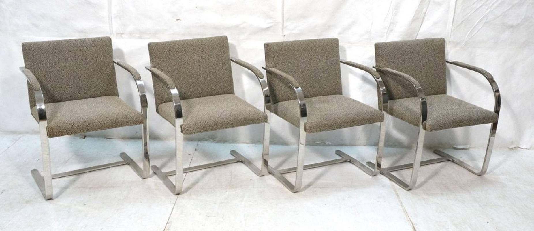 Set of four flat bar chrome cantilever chairs, in the style of Mies van der Rohe's iconic Brno chairs. This set with chrome back bar, attributed to Brueton, circa 1970s.

Measures: 33 in H x 22.5 in W x 24.5 in D.