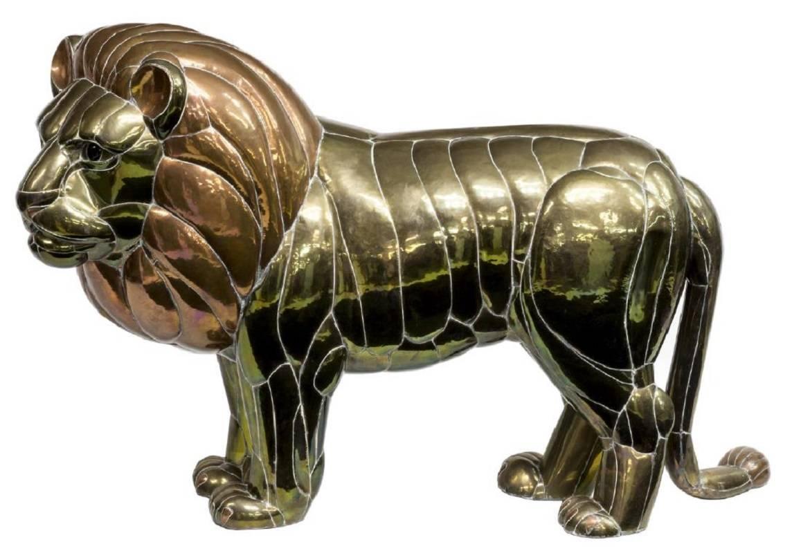 Large brass and copper lion sculpture by Mexican artist Sergio Bustamante. The scale of this piece, as well as the detailing by the artist will ensure that this piece makes a big impression for years to come. Truly a fine example of Bustamante's