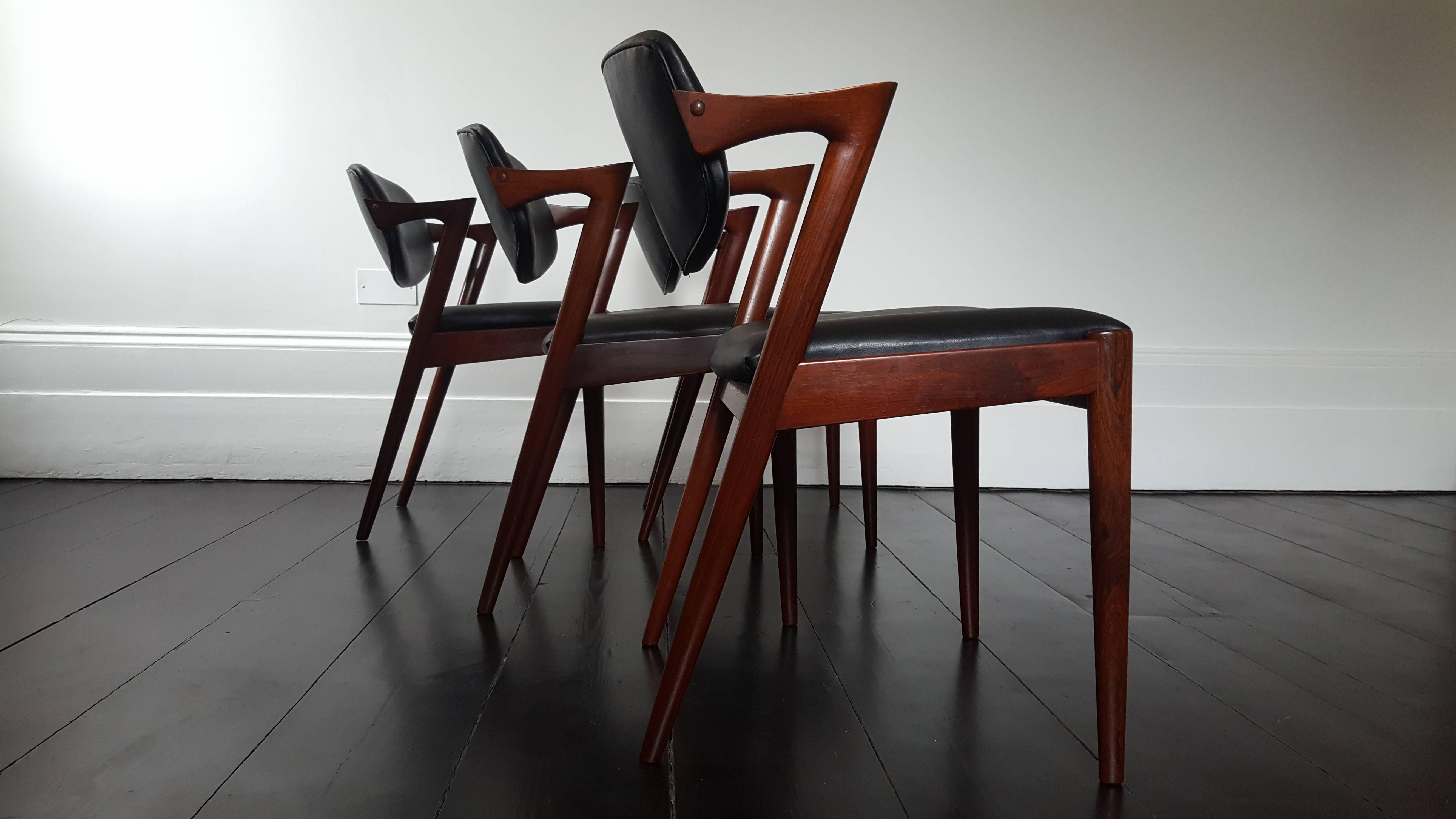 Amazing four Kai Kristiansen model 42 rosewood frame dining chairs for Schou Andersen, 1960s, with black faux leather upholstery.

Size: H 76 x D 48 x W 50; seat height 44 cms

Condition: Good, the chairs have been refurbished and restored but