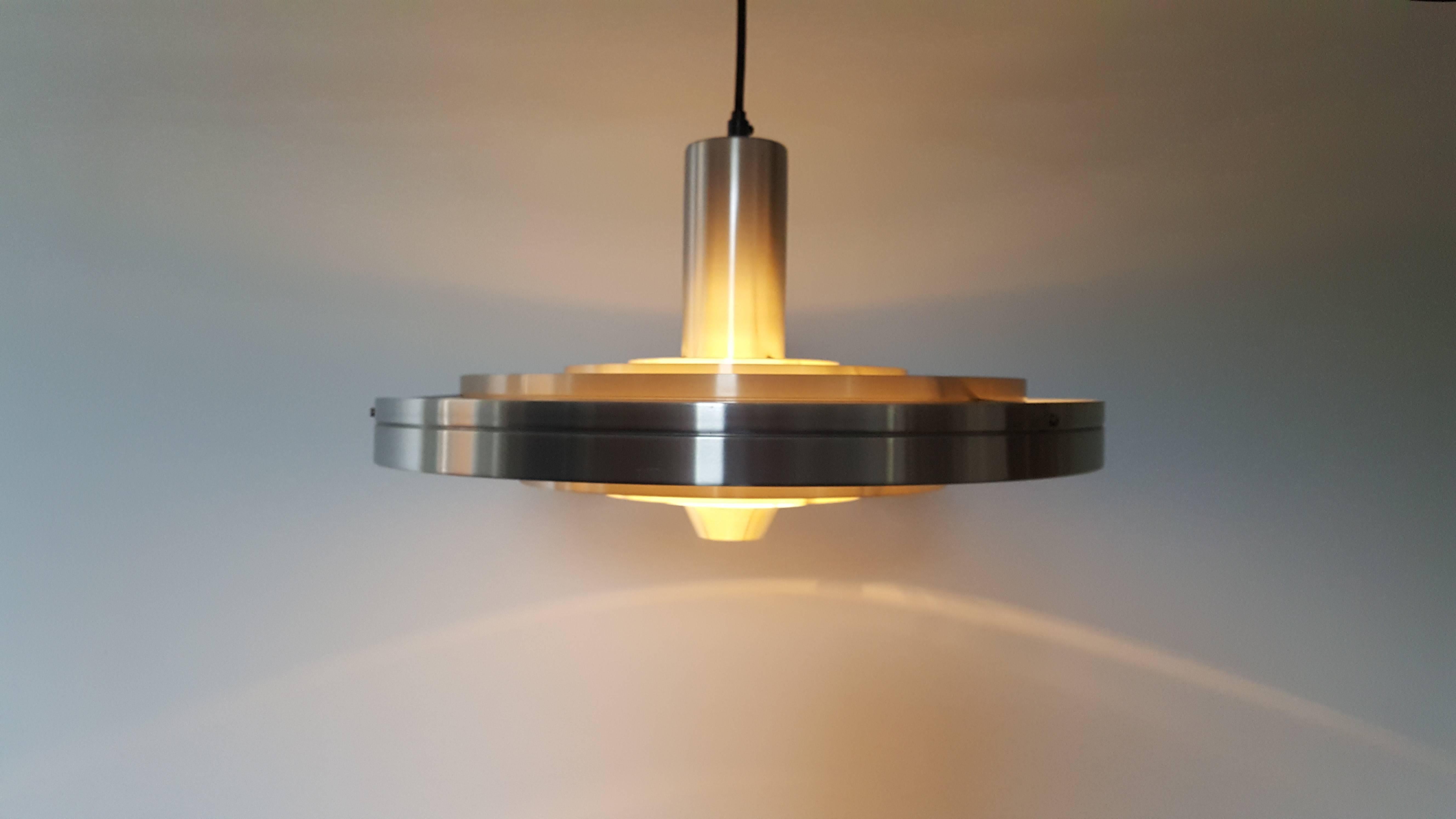 Sophus Frandsen aluminium Fibonacci pendant Light for Fog & Mørup Denmark, 1963.

Danish architect Sophus Frandsen created the Fibonacci light, his timeless 
Classic for Fog & Mørup, in the early 1960s, and it was one of the company’s 
most