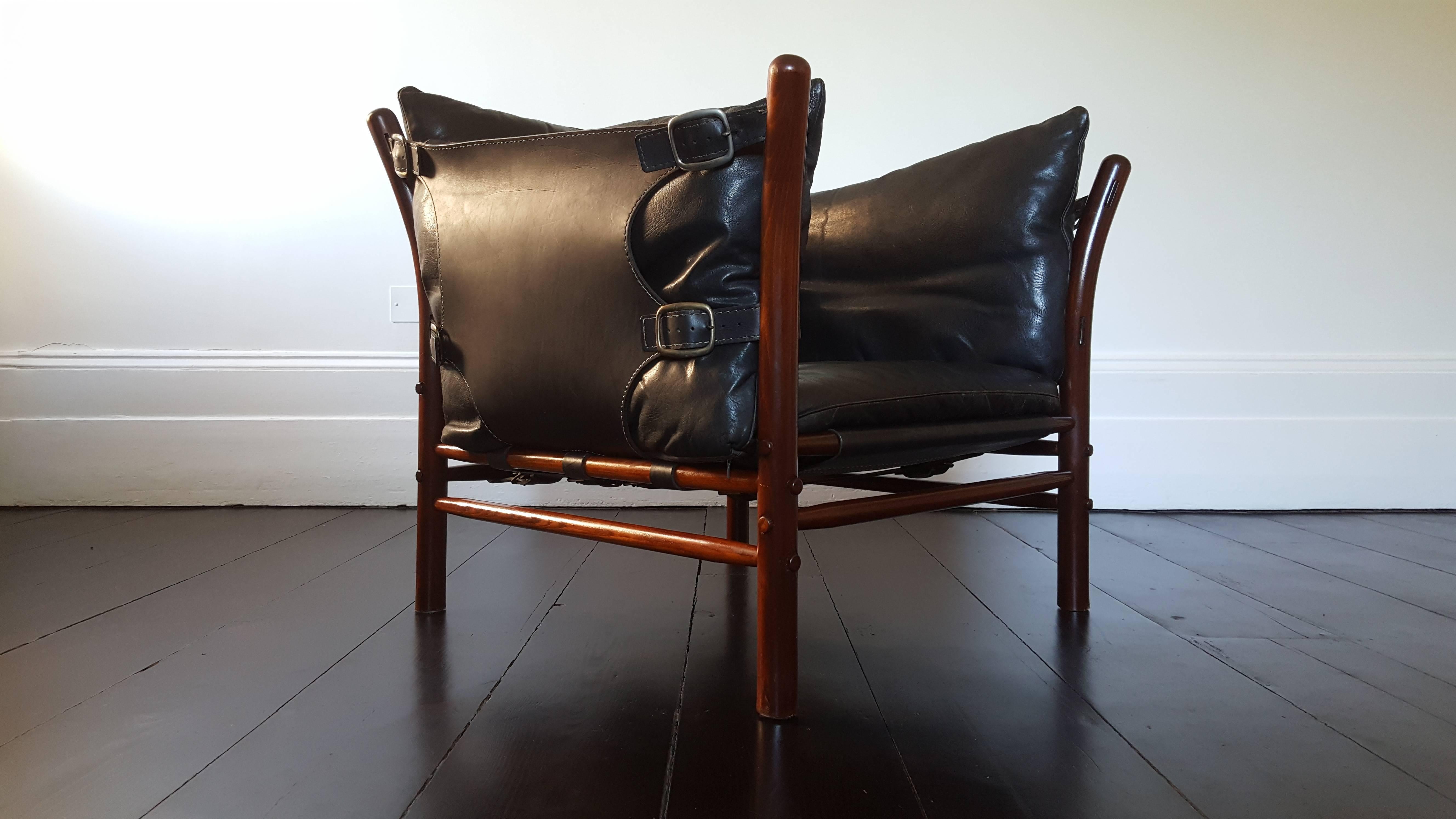 A 1960s 'Ilona' chair by Swedish designer Arne Norell.
 
Featuring jacaranda-stained beech, brass buckles and saddle leather.
 
Great design, amazingly comfortable.

We provide very competitive global shipping rates per your requirements - please