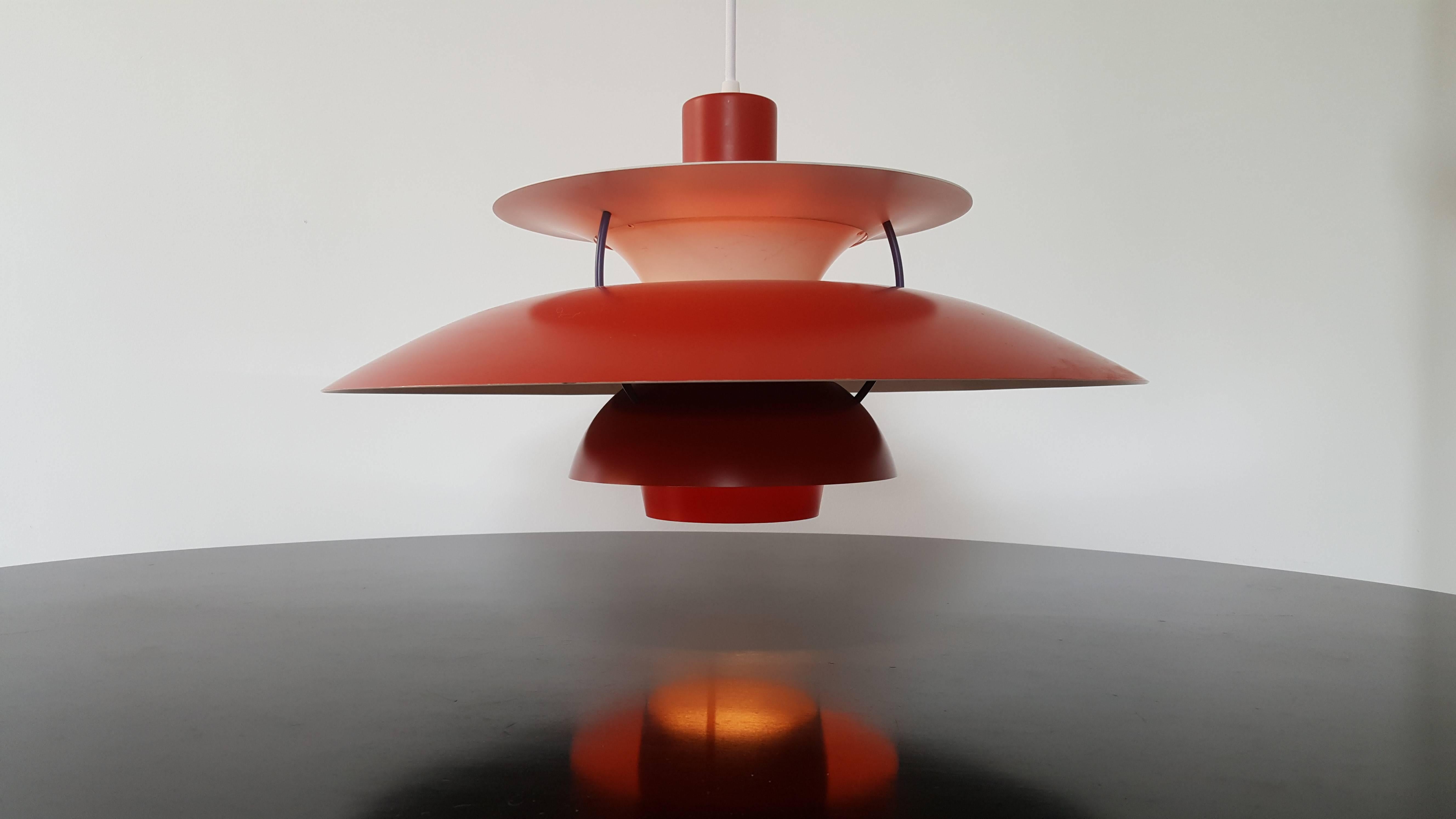 Poul Henningsen PH5 pendant light for Louis Poulsen Denmark in red, designed 1958.

Louis Poulsen’s PH 5 Classic pendant light, designed by Poul Henningsen in 1958, is a Danish design. The pendant’s structure is both elegant and innovative: the