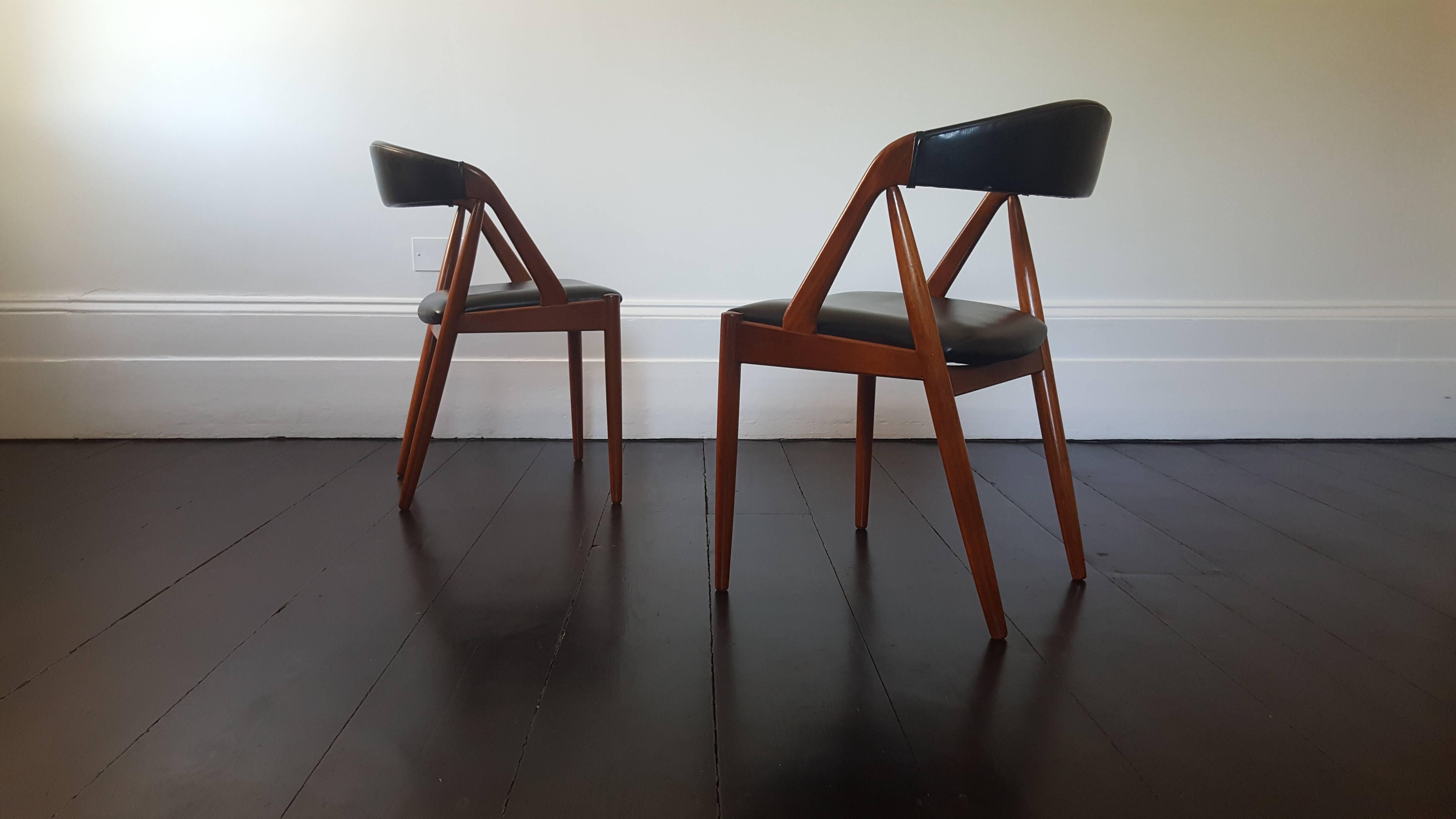 A pair of Kai Kristiansen model 31 teak 'A' frame dining chair for Schou Andersen, 1960s.

Amazing Kai Kristiansen model 31 teak 'A' frame dining chair for Schou Andersen 1960s, original faux black leather upholstery.

We provide very competitive