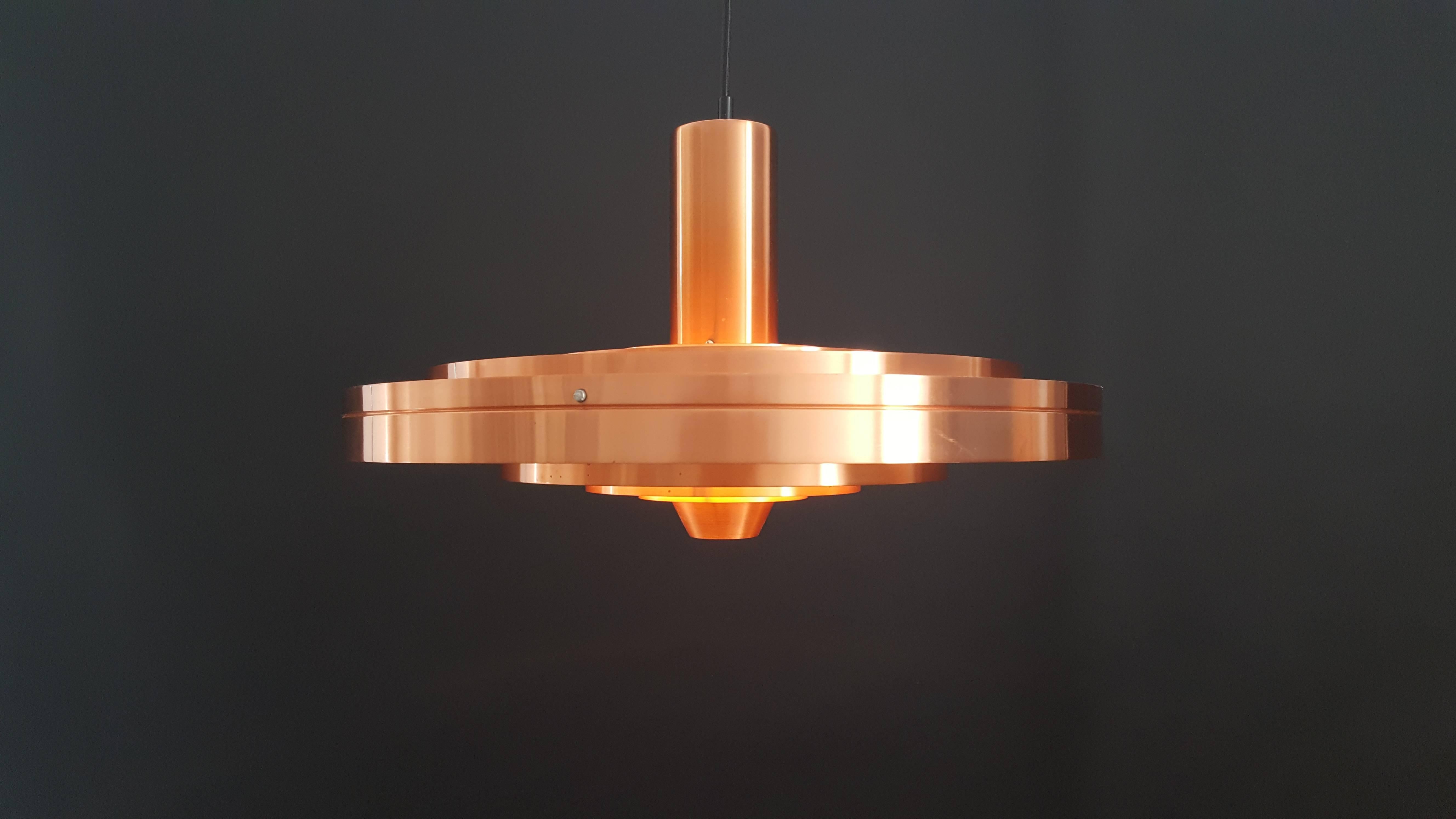 Sophus Frandsen copper Fibonacci pendant light for Fog & Mørup, Denmark, 1963.

Danish architect Sophus Frandsen created the Fibonacci light, his timeless Classic for Fog & Mørup, in the early 1960s, and it was one of the company’s most expensive
