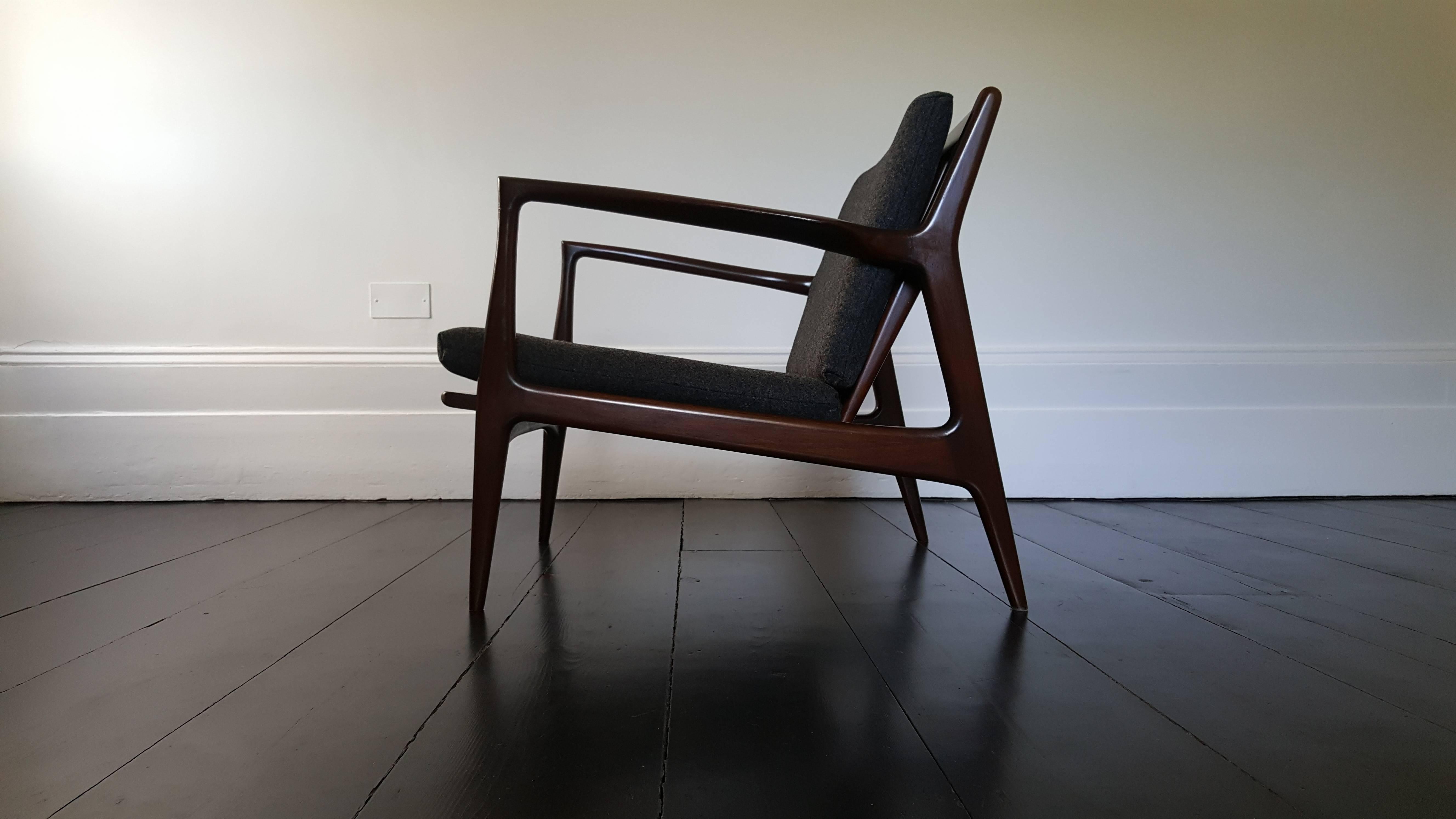 Stunning vintage Mid-Century Ib Kofod-Larsen armchair in stained Beech with new dark grey wool. Manufactured by Selig.

Ib Kofod-Larsen was an acclaimed Danish furniture designer. He graduated from the Royal Danish Academy of Fine arts and went on