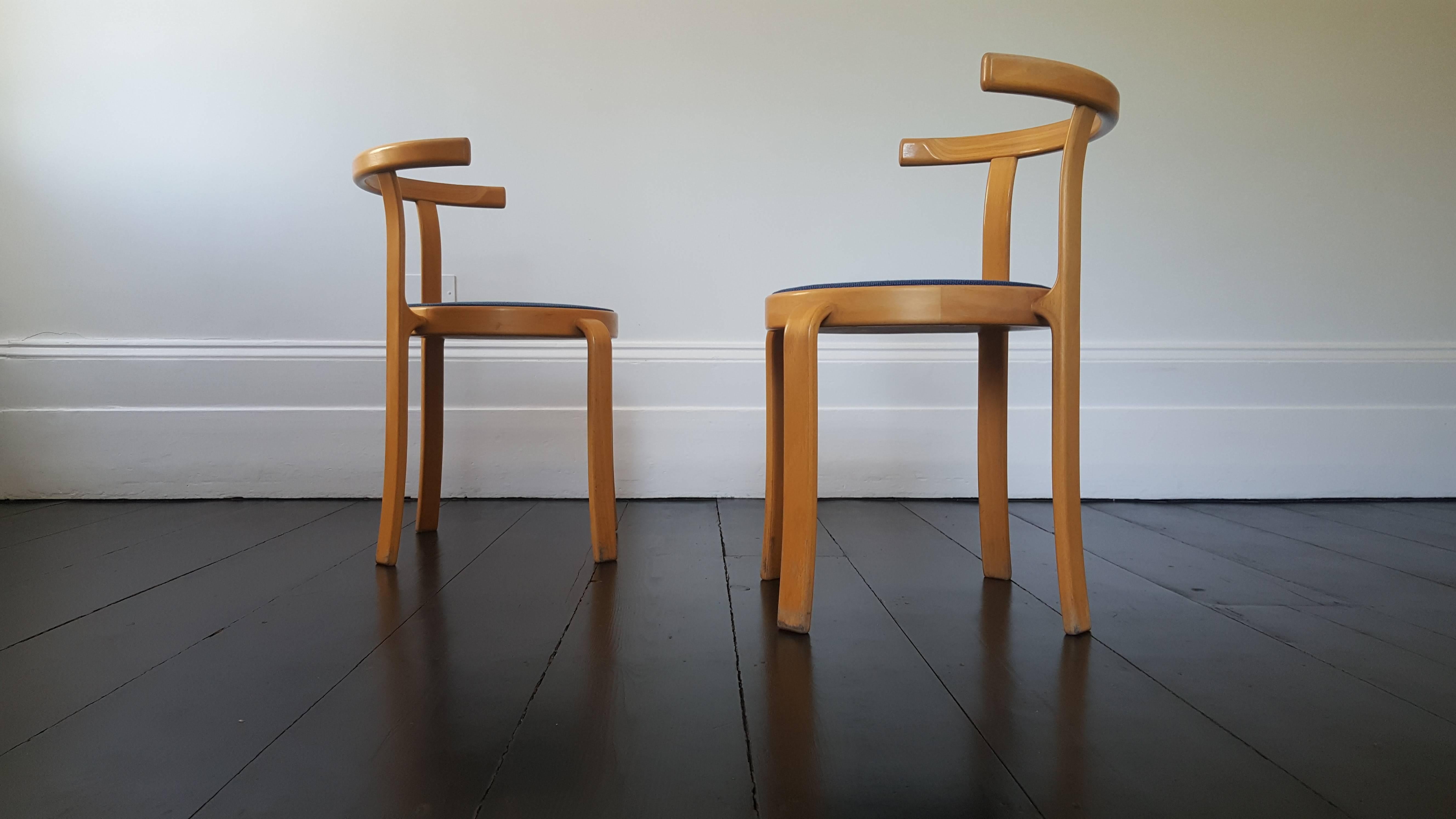 A pair of Danish stackable Magnus Olesen 8000 series chairs designed by Rud Thygesen and Johnny Sorensen during the 1980s.
 
Great shape and appearance.
 
Produced in beech.