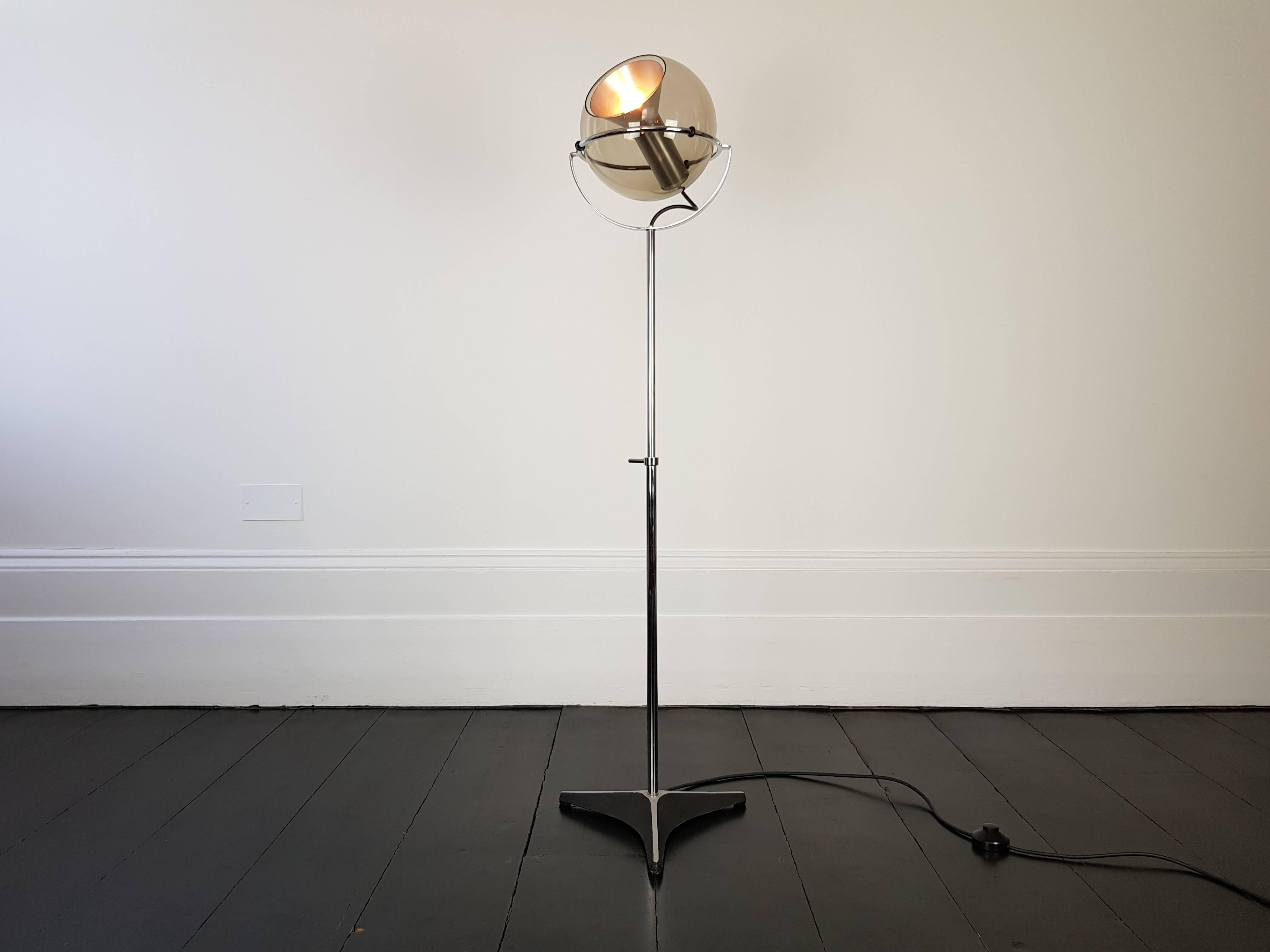 A globe 2000 floor lamp by Frank Ligtelijn for, RAAK, Amsterdam, 1970s.
 
Amber glass globe with chromed adjustable stand, ranging from 125cm to 165cm in height.
 
A famous design by Frank Ligtelijn coupled with the high quality manufacturing