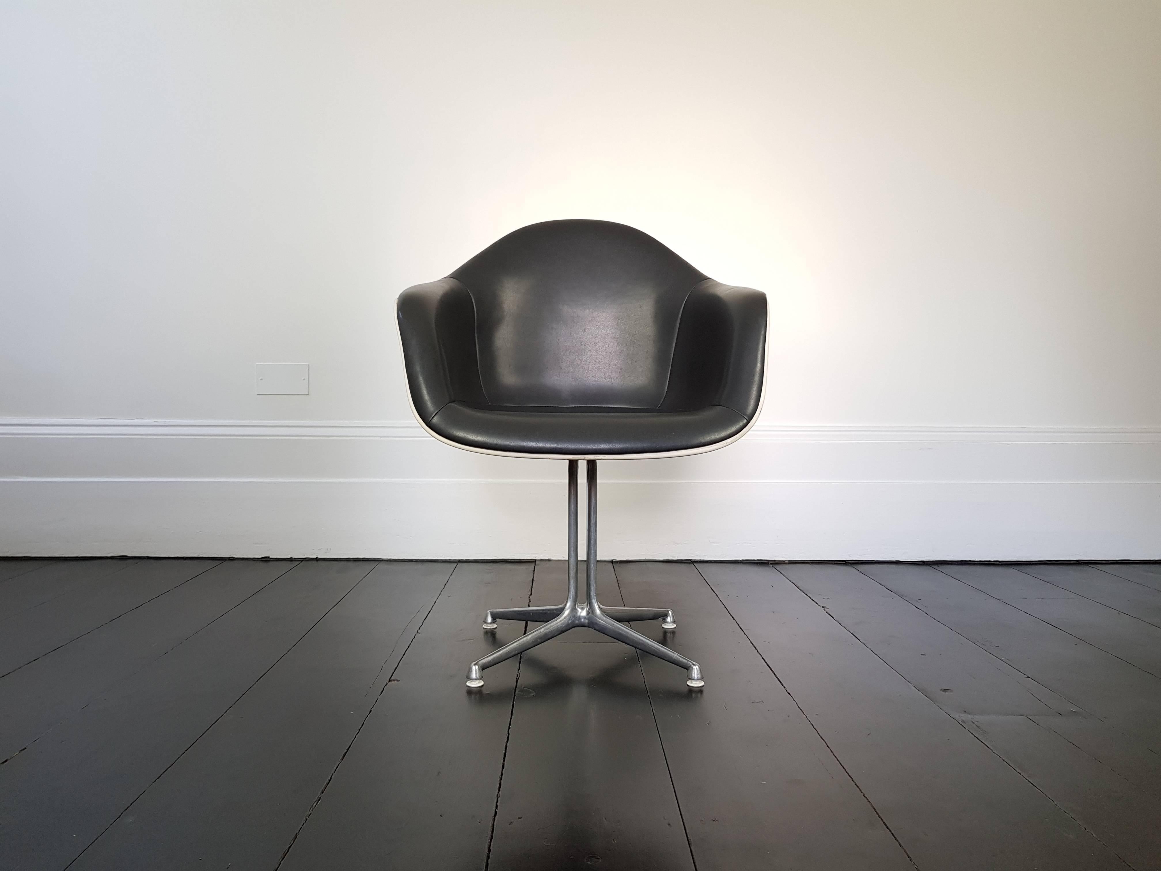 Eames 'La Fonda' chair. Aluminium frame with fibreglass shells and grey leatherette, Herman Miller.

            