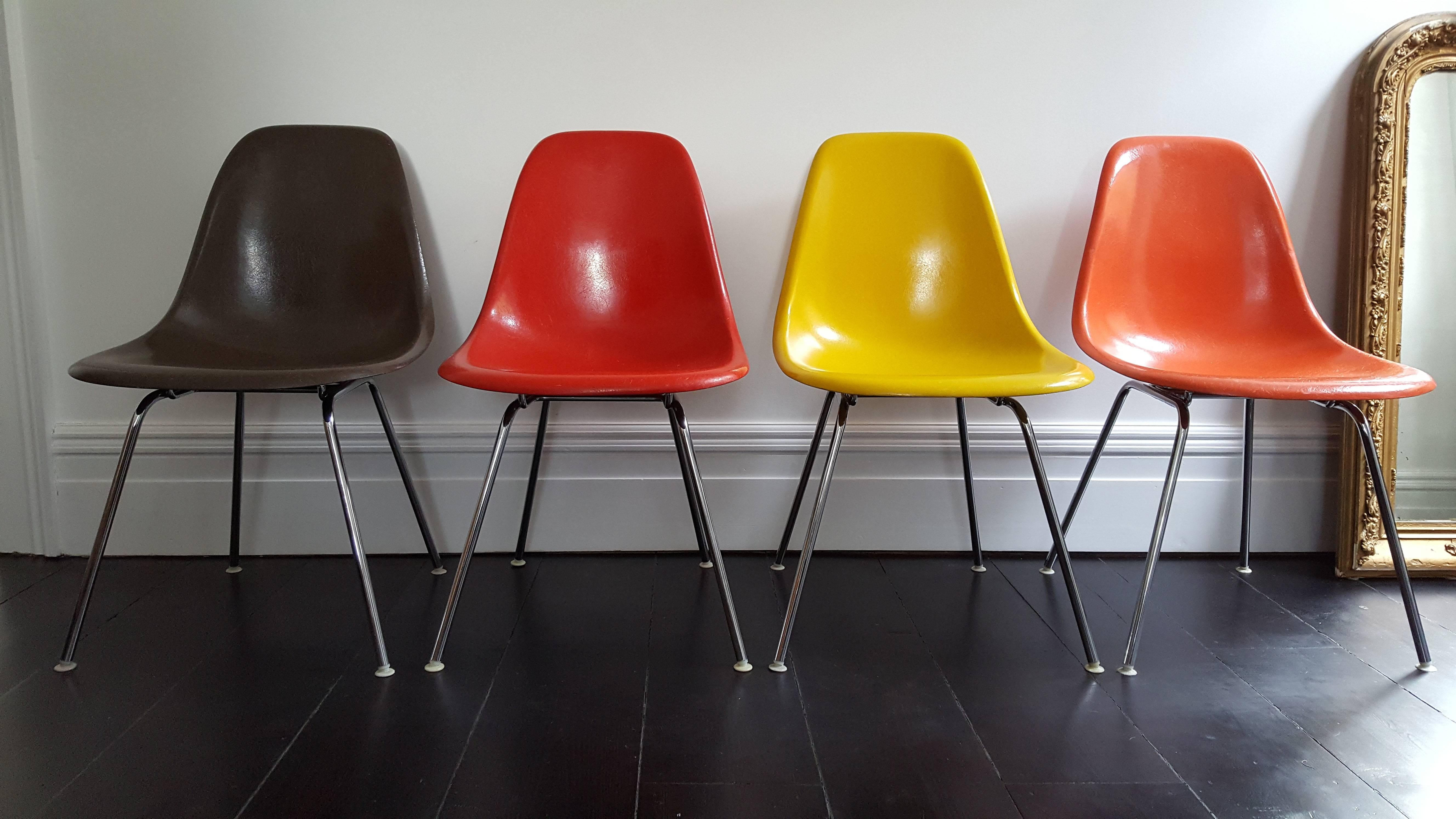 A set of vintage four vibrant multicoloured fibreglass Charles and Ray Eames designed DSX chairs on chrome H bases by Herman Miller/Vitra. 

For delivery, the chairs will be disassembled for shipping. If you prefer the items shipped assembled