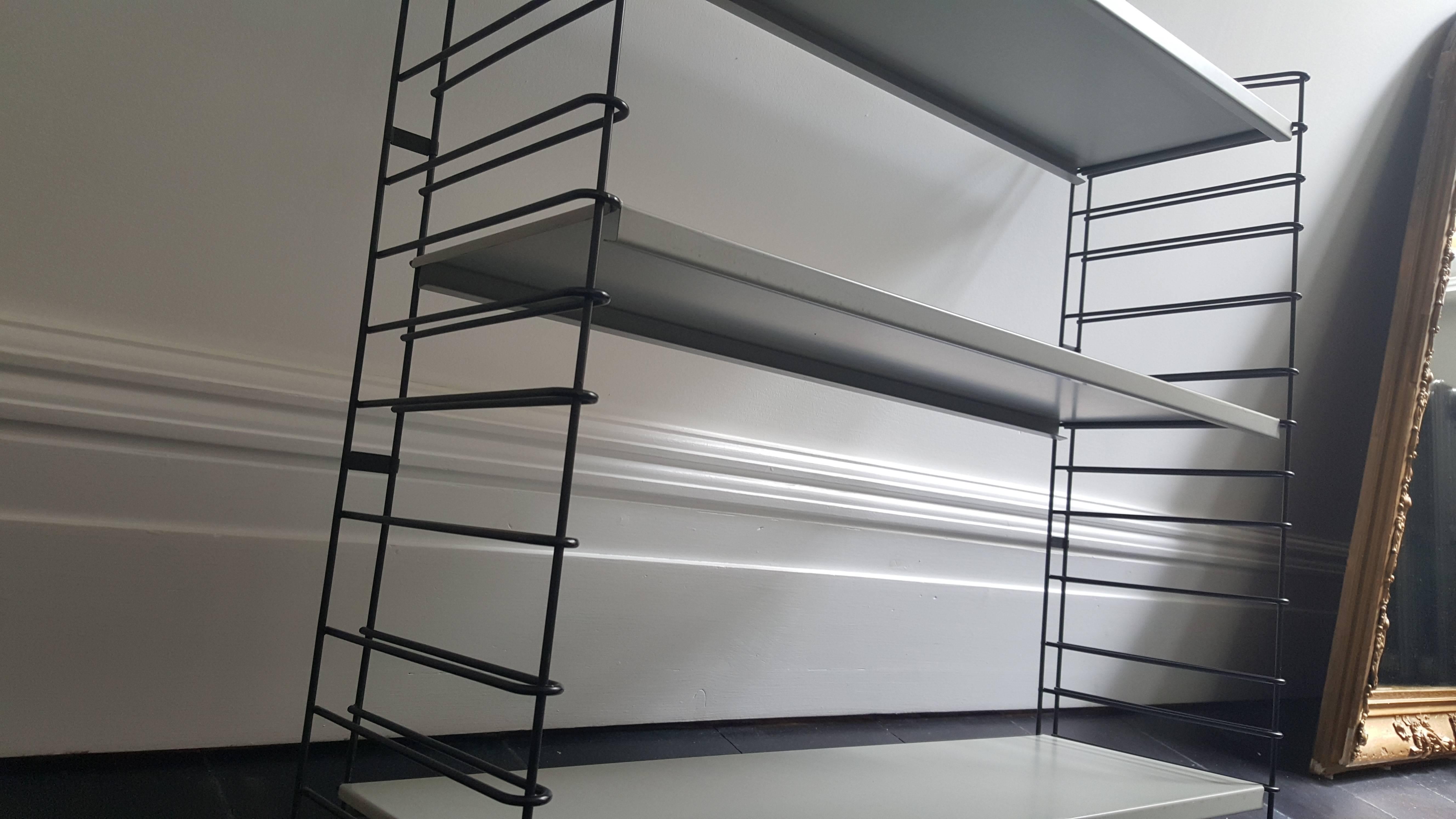 Eye-catching Classic vintage Dutch Tomado shelves or book racks designed mid-1950s. 

Powder coated frame and adjustable steel shelves (grey).

Global shipping available, please contact to discuss.