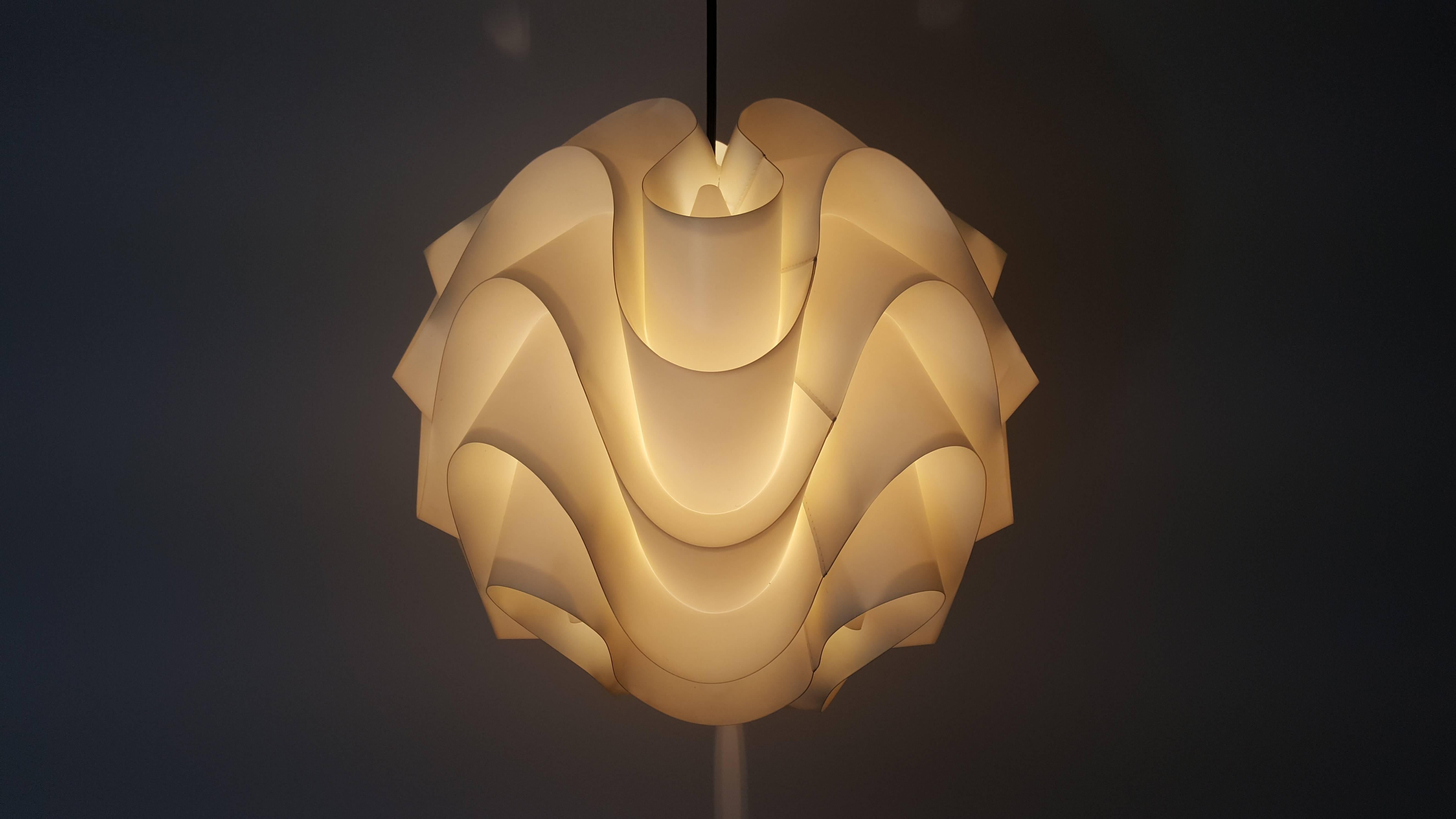 Poul Christiansen model 172 for Le Klint, designed 1969. 

Poul Christiansen model 172 for Le Klint pendant diffuses the light produced by a single bulb and produces various shades and illuminates the folds and shapes in the light with amazing