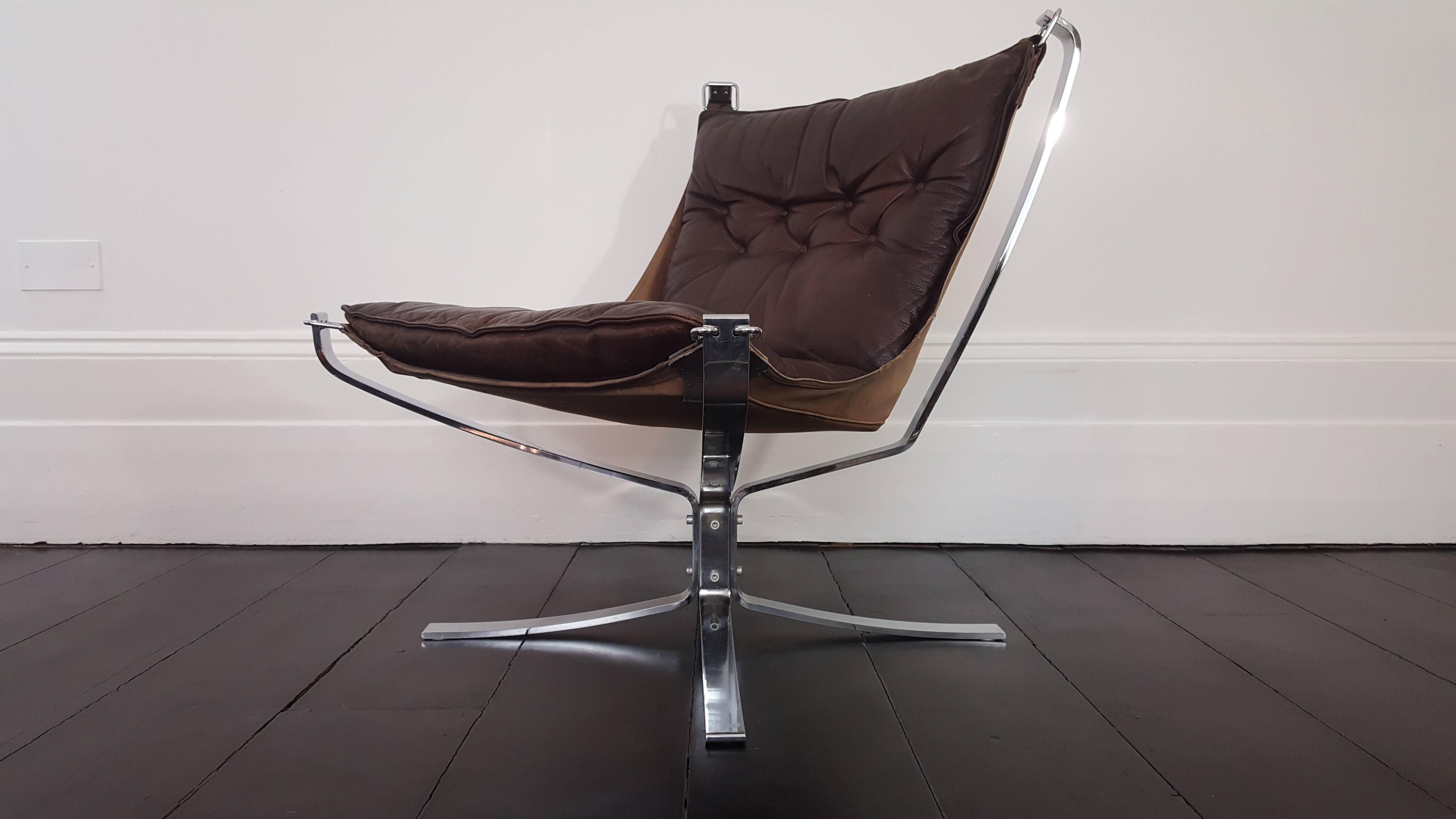 Iconic vintage low-backed X-framed Sigurd Ressell designed 1970s falcon chair on chromed steel base.

A super comfortable, amazing looking 1970s Sigurd Ressell designed falcon chair. X-framed with hammock design. Early Falcon chairs were made