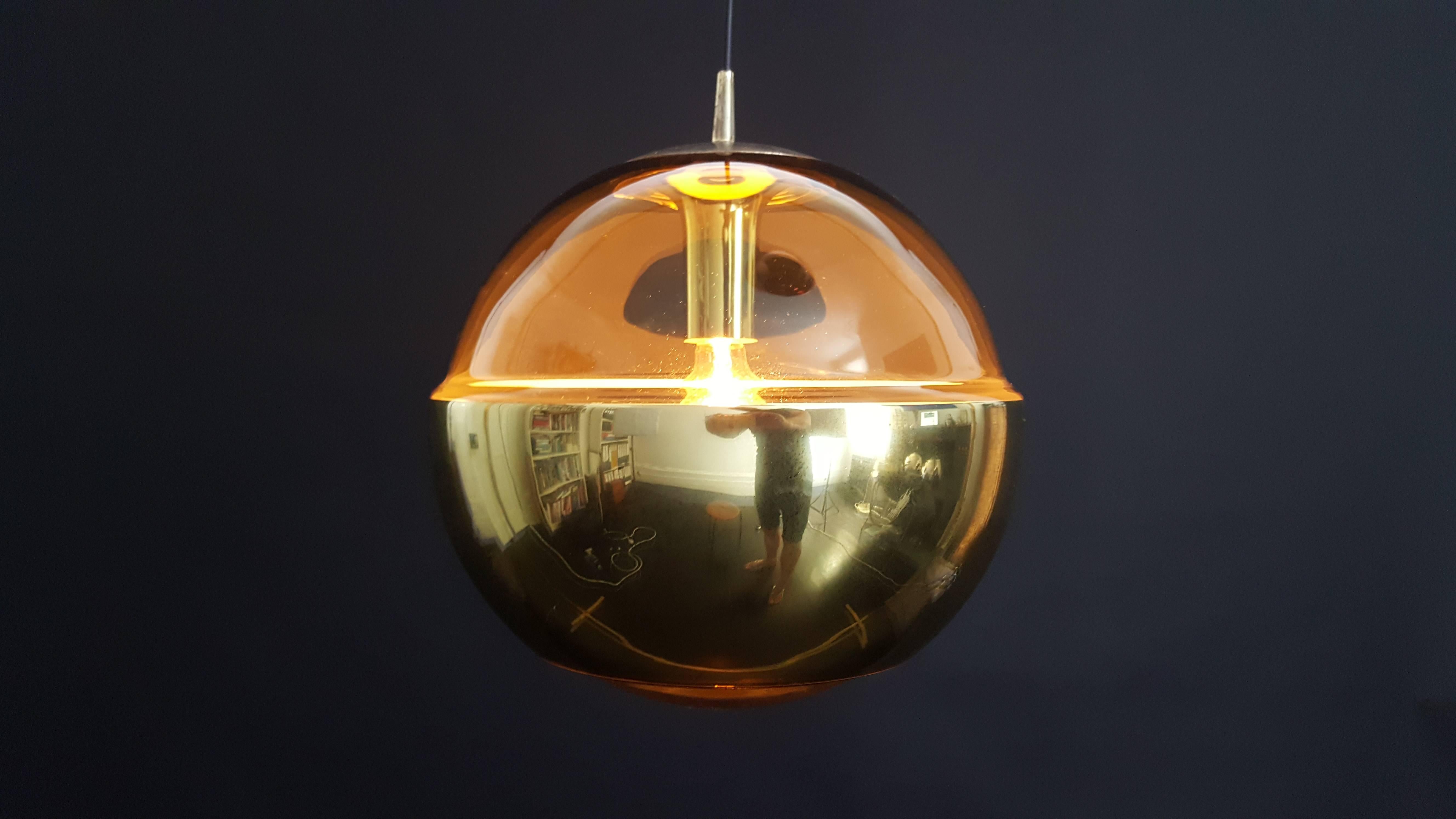 An imposing large Peill and Putzler brassed metal and amber glass spherical ceiling light, great look both lit and unlit.

Fully working, rewired and safety tested and passed - supplied with a new minimal ceiling rose.

Global shipping available.