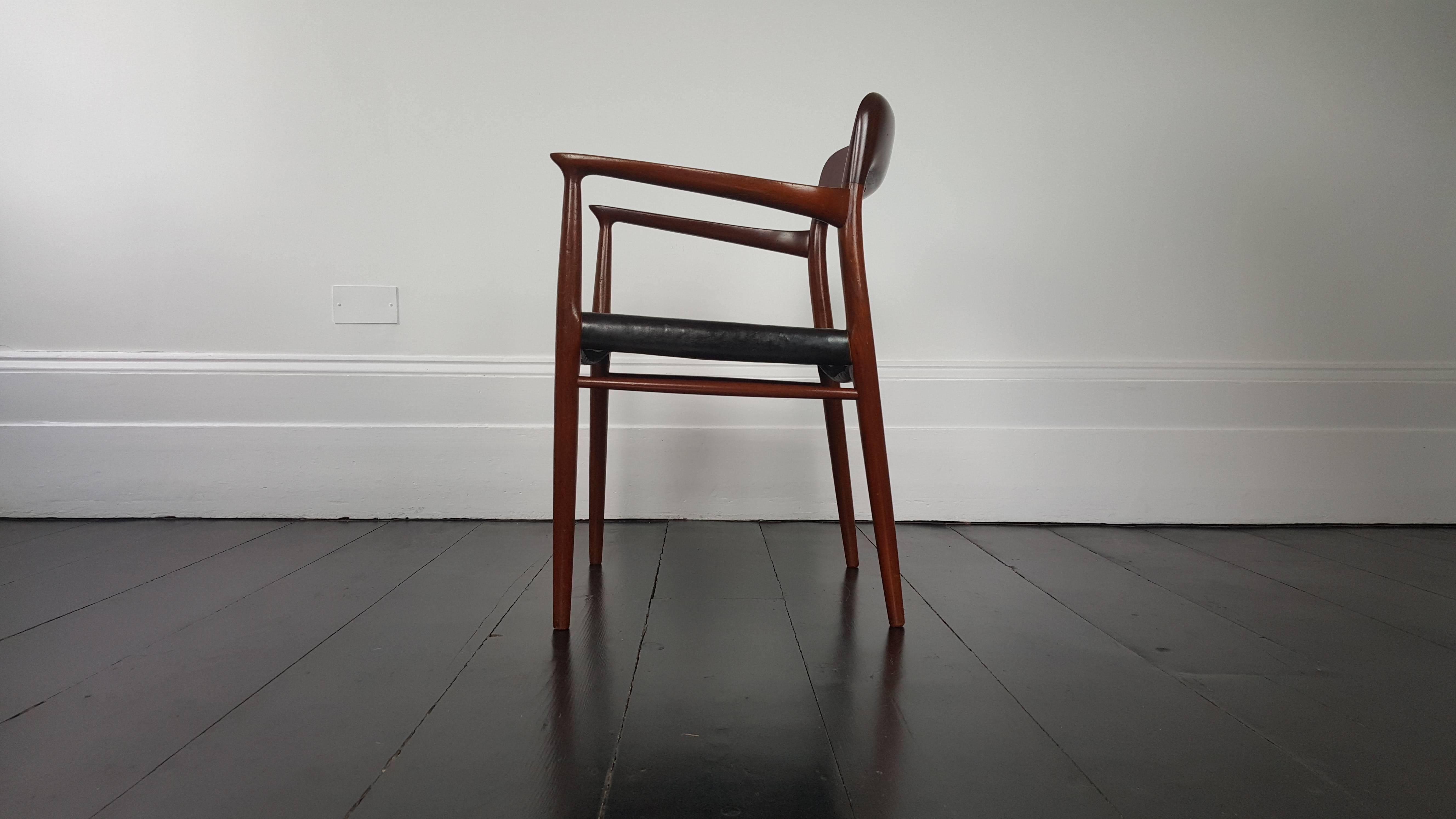 A Model 56 armchair in teak and black leather by Niels Otto Møller for J. L. Møller, Denmark, 1954.
 
A beautifully shaped frame crafted in solid teak with a seat pad covered in black leather which has great patina.

Please contact us via the