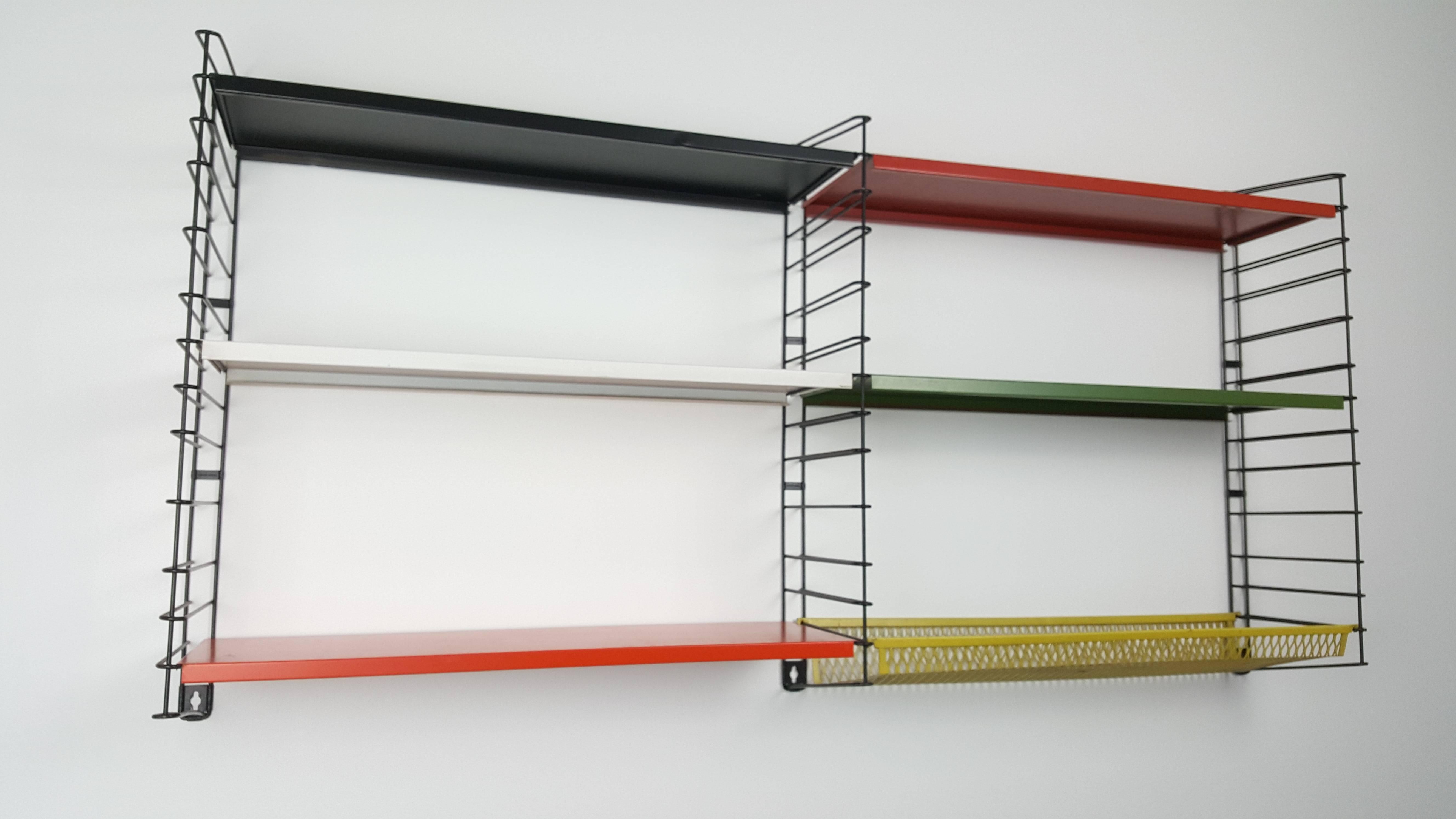 Classic and iconic vintage Dutch Tomado freestanding shelves, designed mid-1950s by D. Dekker.

Powder coated frame and adjustable steel shelves. This design looks amazing in any room and location and are highly collectable.

 
 