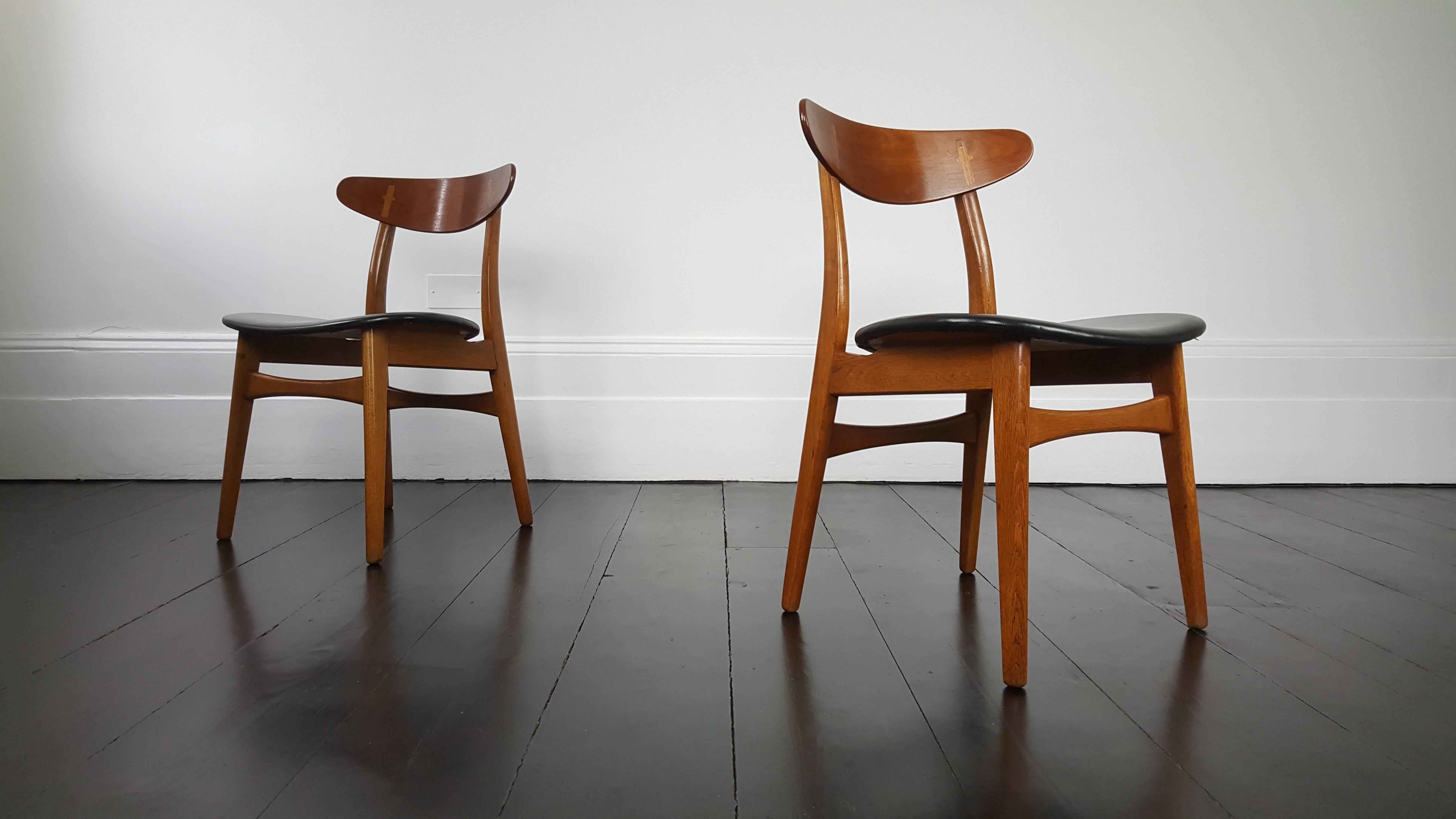 A pair of Hans J. Wegner chairs for Carl Hansen & Søn. Designed in 1952, the CH-30 was one of Wegner's first and most famous dining chair designs.
 
Featuring leather upholstery and exposed joints the CH-30 is an iconic classic.

 