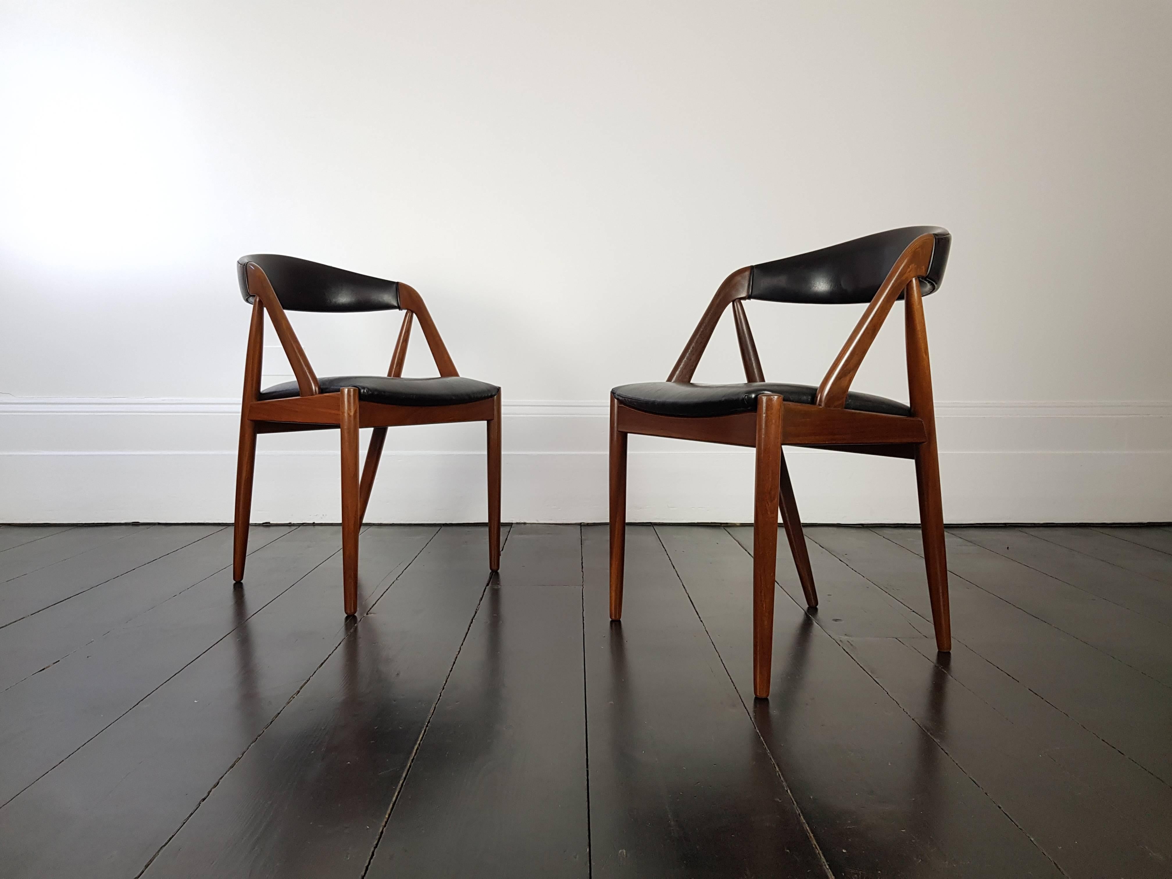 A pair of Kai Kristiansen model 31 teak 'A' frame dining chair for Schou Andersen, 1960s.

Amazing Kai Kristiansen model 31 teak 'A' frame dining chair for Schou Andersen, 1960s, original faux black leather upholstery.

   