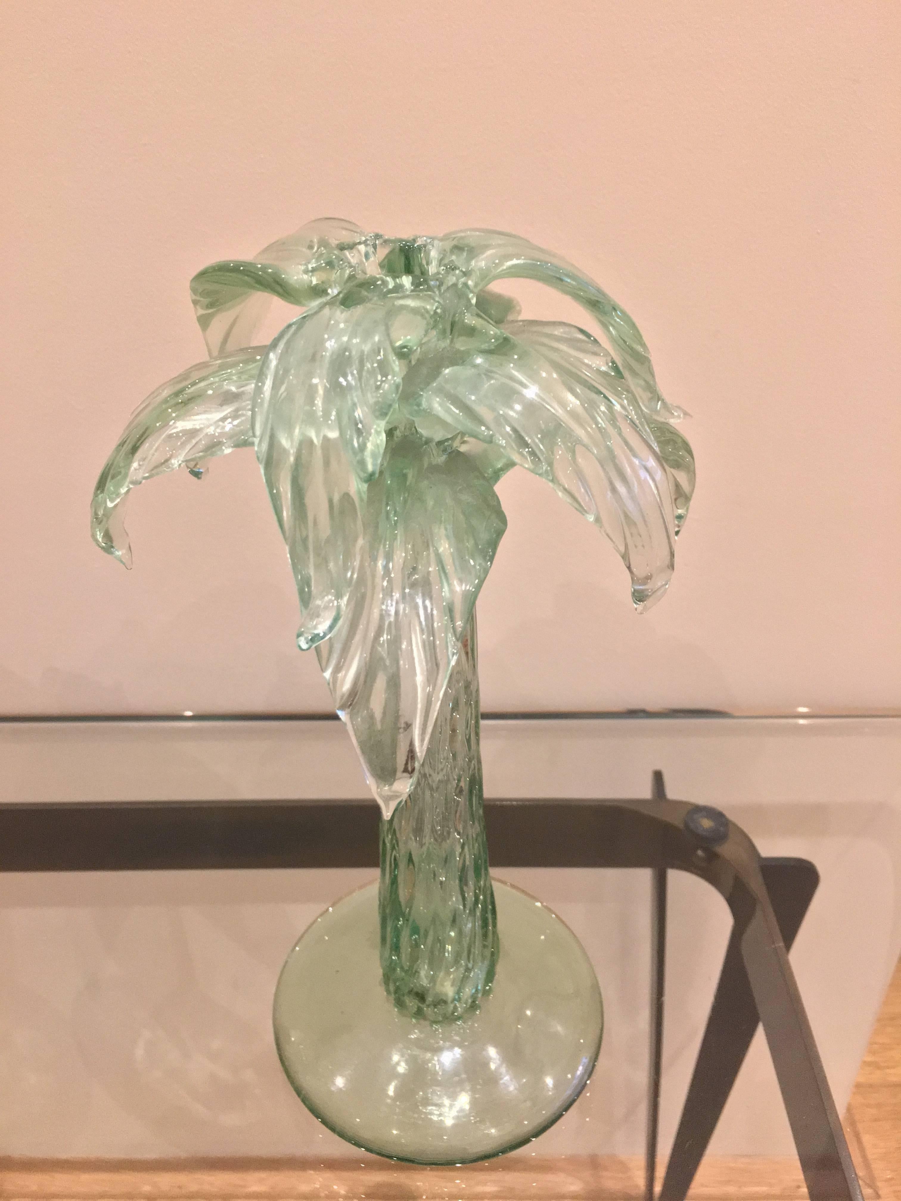 A pair of Murano glass candlestick, for one single candle each. The glass green coloured. Very fine glass handwork.