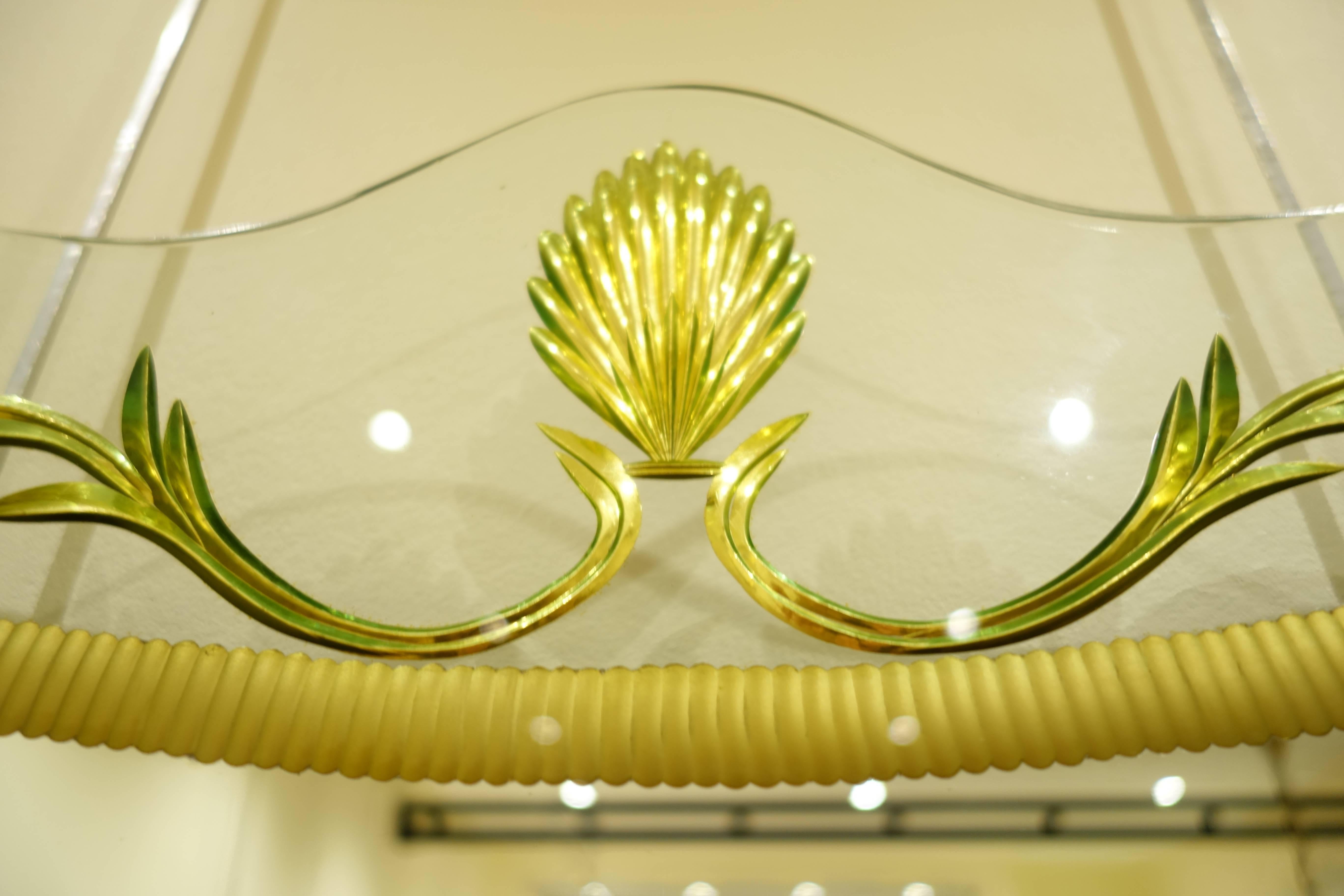 The mirror is typical of crystal Art works of the 1930s. The yellow colour is quite rare.