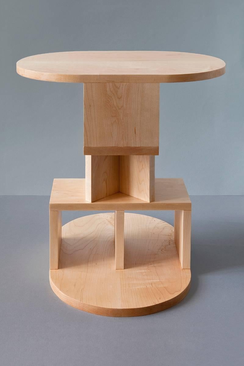 With a playful nod to Postmodern design, the double pyramid table by designer Michael Schoner transforms the side table into a tower-like sculpture with equally balanced proportions. This side table is handcrafted from solid maple in the