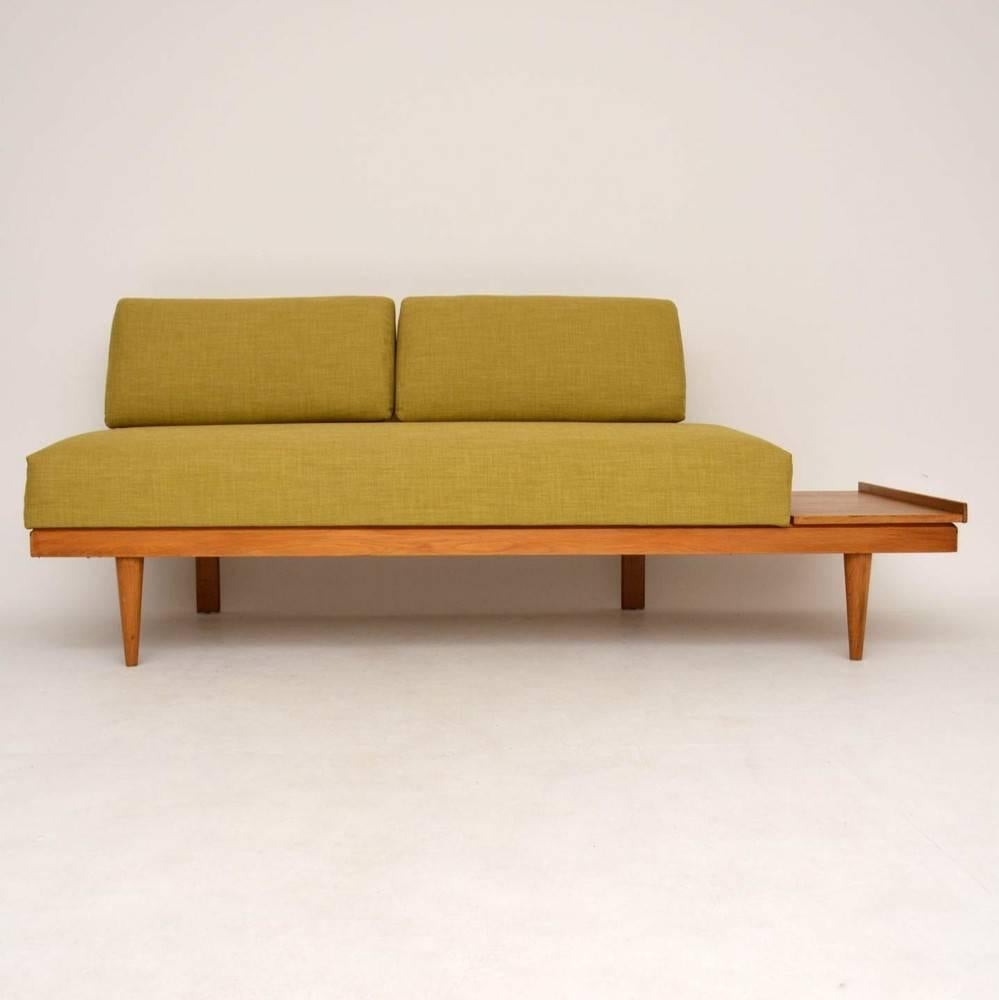A beautiful and rare sofa bed, this was designed by Ingmar Relling and was made in Norway during the 1960s by Swane. The condition is excellent for its age, the Oak frame is clean, sturdy and sound, with just some very minor wear to the polish on