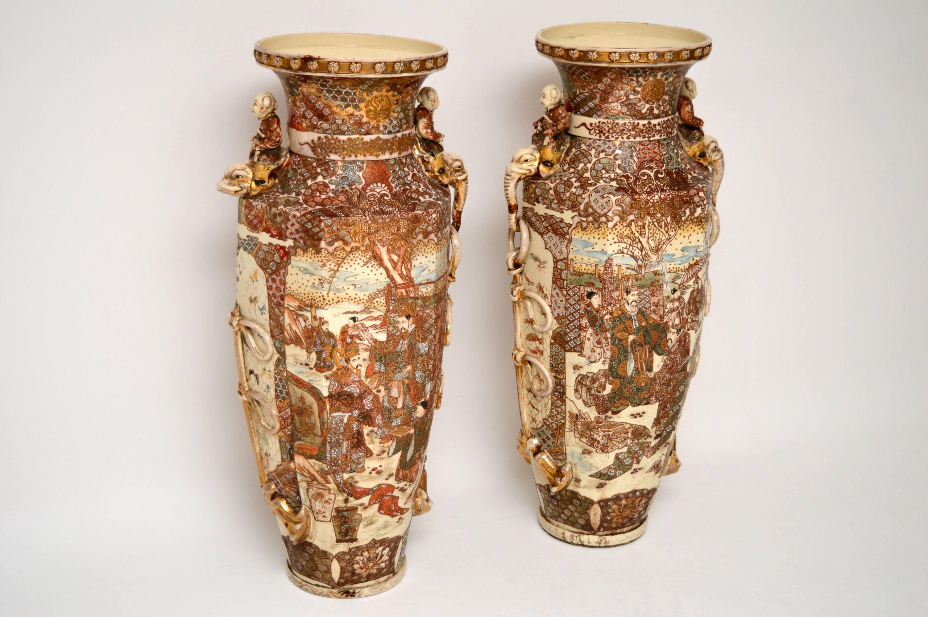 Very large pair of antique Japanese Satsuma vases, which I believe date from around the 1910 period. They may even be a bit older. I've never had a pair of vases anywhere near this large. There is a bit of damage to some of the outer mouldings and I