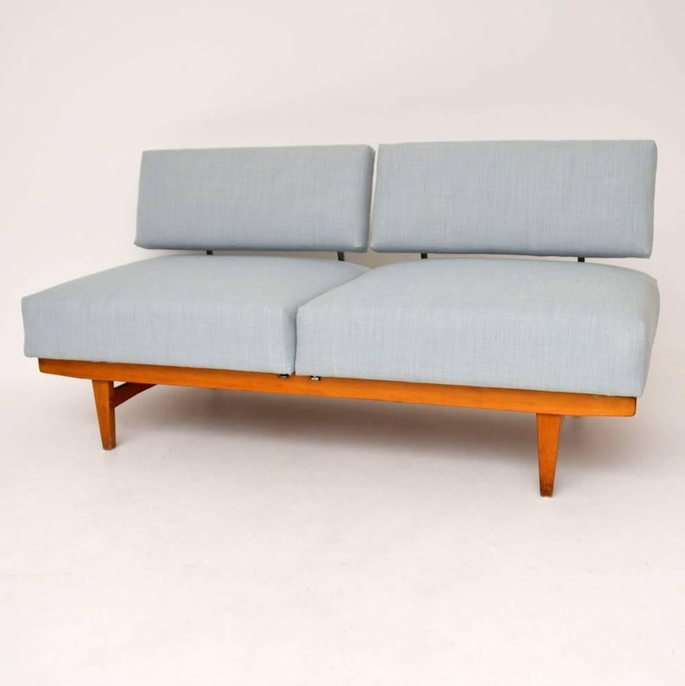 A very stylish and practical sofa bed, this was made by Wilhelm Knoll and dates from around the 1950-60s. It's in excellent condition for its age, we've had this re-upholstered in our light blue stain repellent fabric. There is just some minor wear
