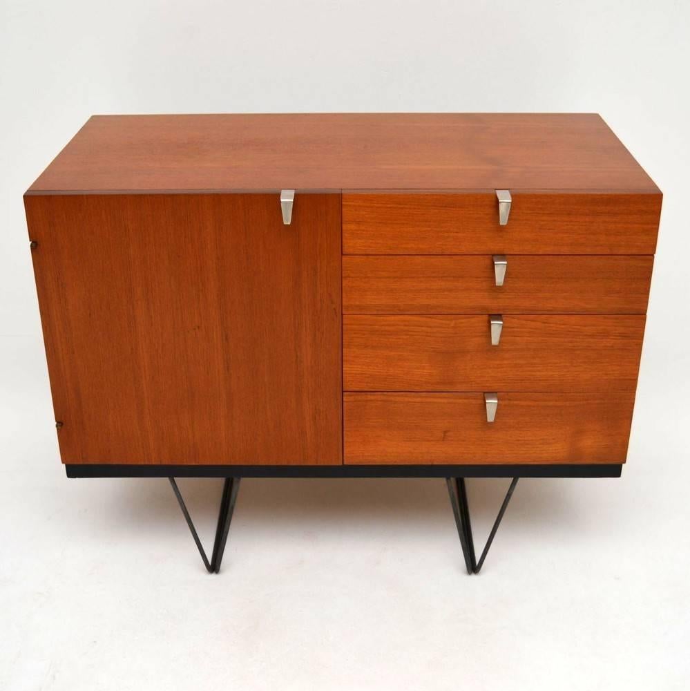 A beautiful and rare cabinet in teak, this is from stag furniture's S range. It was designed by John & Sylvia Reid in the 1950s. This has been stripped and re-polished to a very high standard, the condition is excellent throughout. Originally this