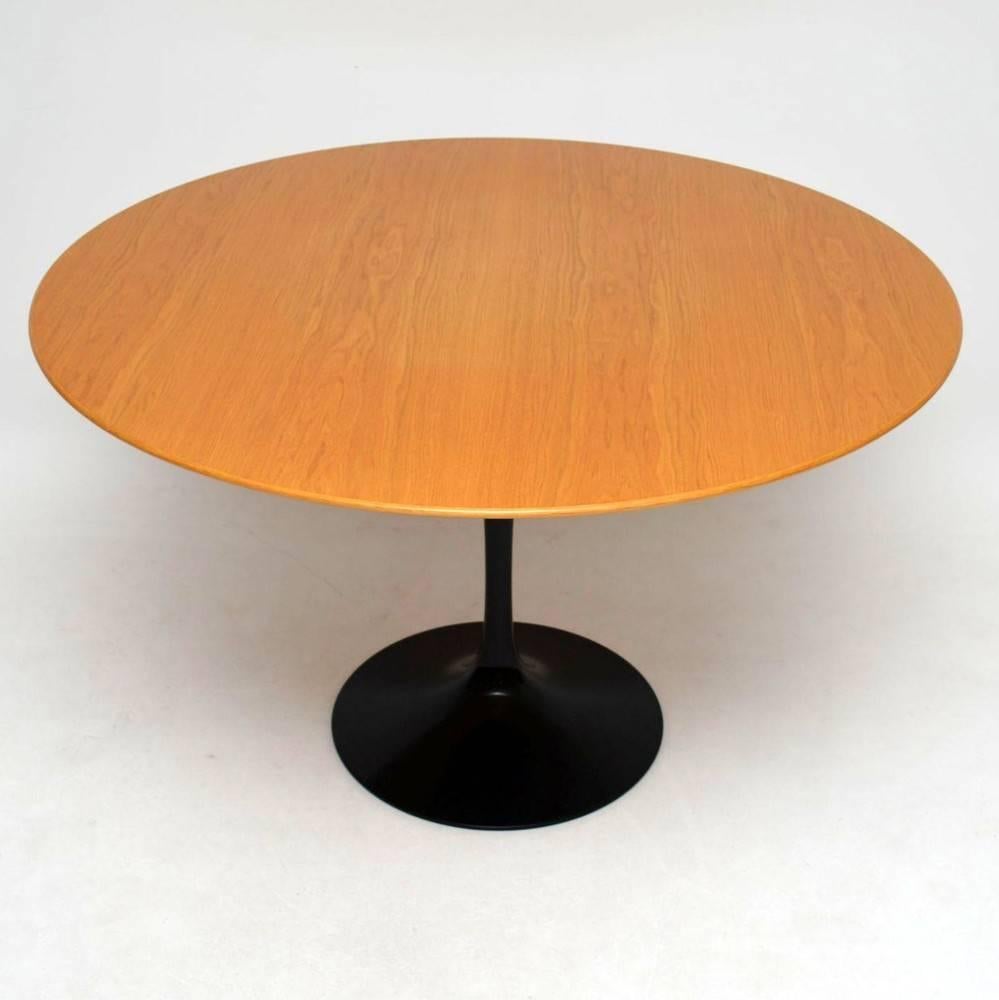 A stunning and iconic tulip dining table of the utmost quality, this was designed by Eero Saarinen and was made by Knoll International. This one has a Teak top, it was made in 2007 and it's a 50th anniversary special edition with commemorative