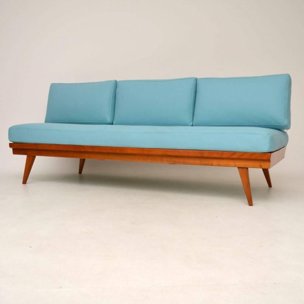 This is an absolutely stunning sofa bed of the utmost quality, made by Wilhelm Knoll and dating from the 1950-1960s. We have had the frame fully stripped and re-polished, to a very high standard, it has a gorgeous color and is in superb condition.