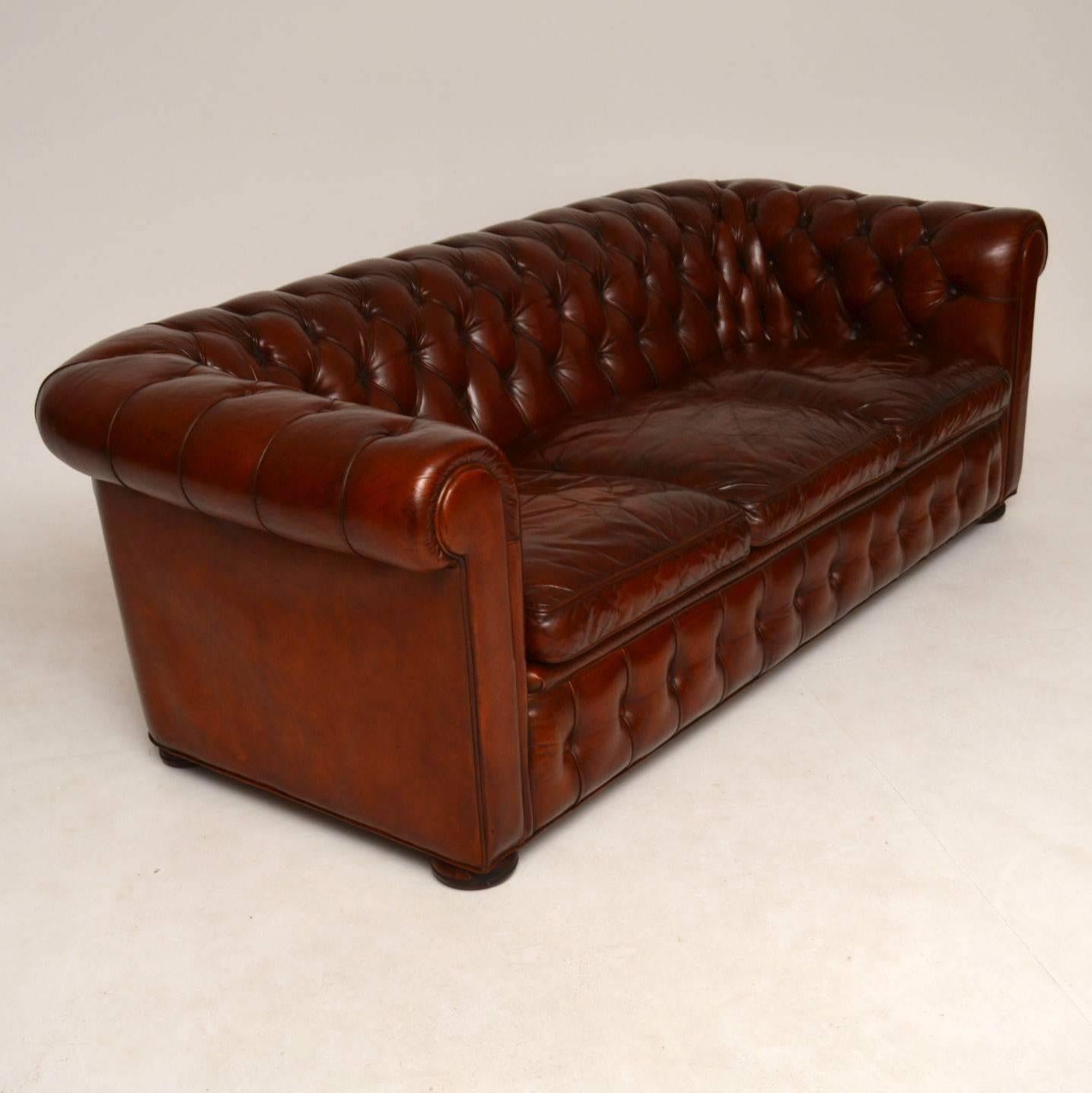 Very comfortable antique three-seat leather chesterfield in good original condition and of excellent quality. The back and arms are deep buttoned with three seat cushions and it sits on turned bun feet. The leather is original & it's a kind of