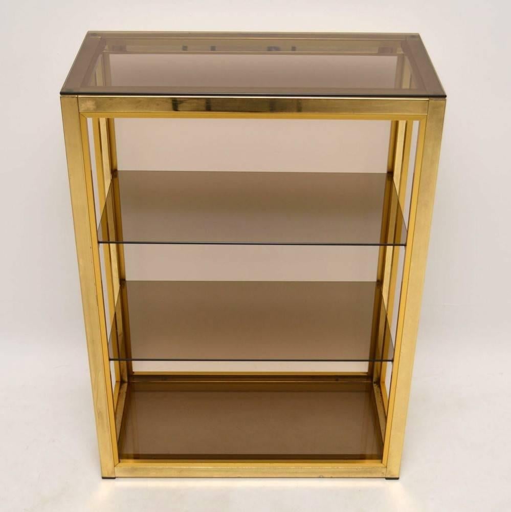 A beautiful bookcase or cabinet by Zevi, this was made in Italy and dates from the 1970s. These are normally seen with a chrome finish, this one is quite unusual as it has a lovely brass finish. It's not solid brass, it's a lighter metal, with