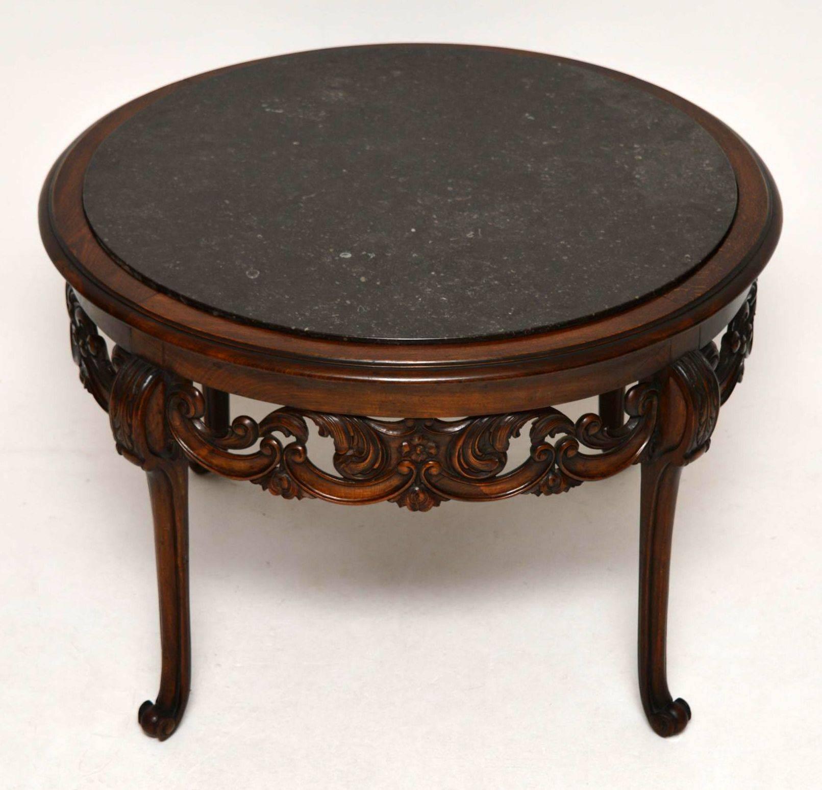 Antique Swedish marble top carved walnut coffee table in good original condition. I would date this table to around the 1890-1900 period and it came over from Sweden along with a matching three piece bergere suite, which can be found in the seating