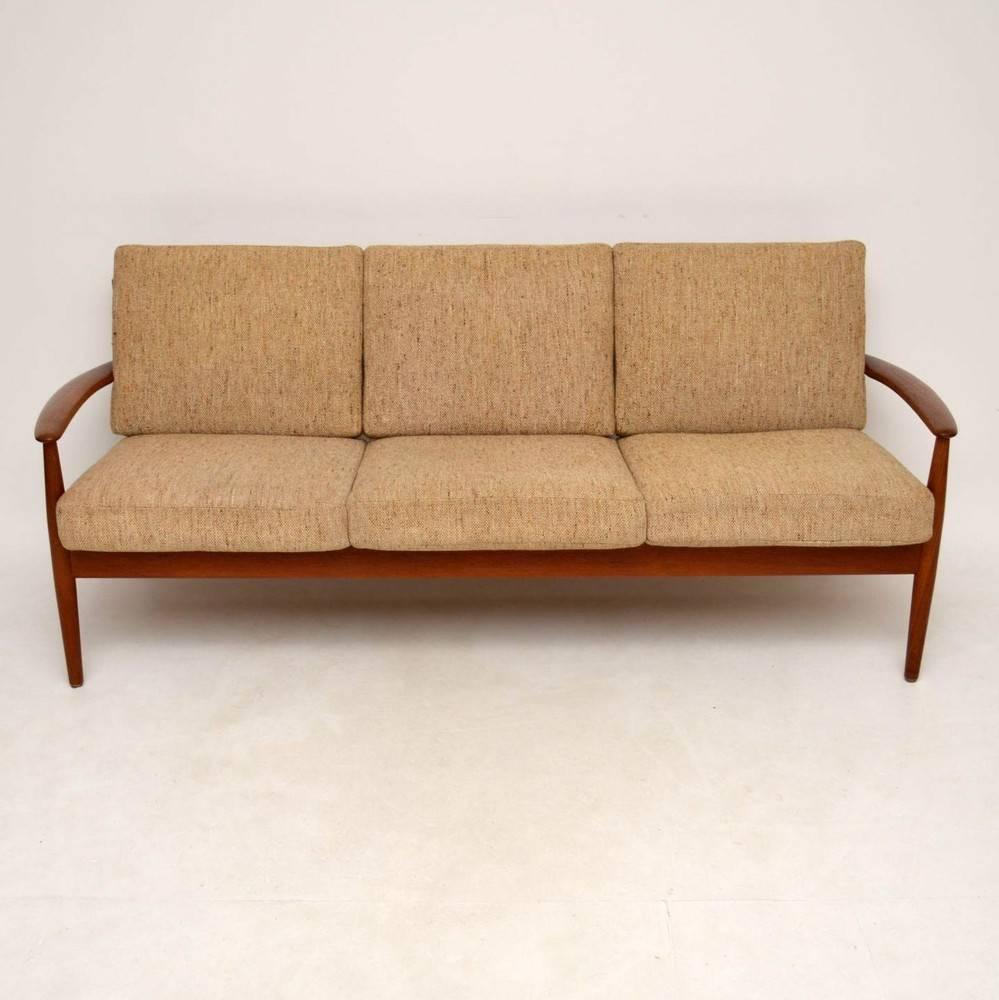 A stylish and top quality Danish teak sofa, this was designed by Grete Jalk, it was made by France & Son in the 1960s. The condition is excellent for its age, with only some very minor wear here and there. The solid teak frame is beautifully