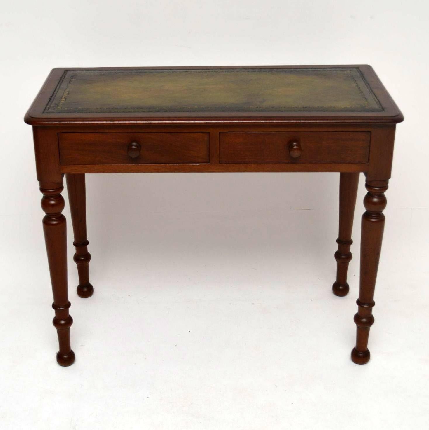 Antique leather top mahogany writing table dating from around the 1860s-1880s period and in good condition. It has a tooled leather writing surface, two drawers and sits on nicely turned legs.

Measures: Length 36.2", 92 cm
Depth 18",
