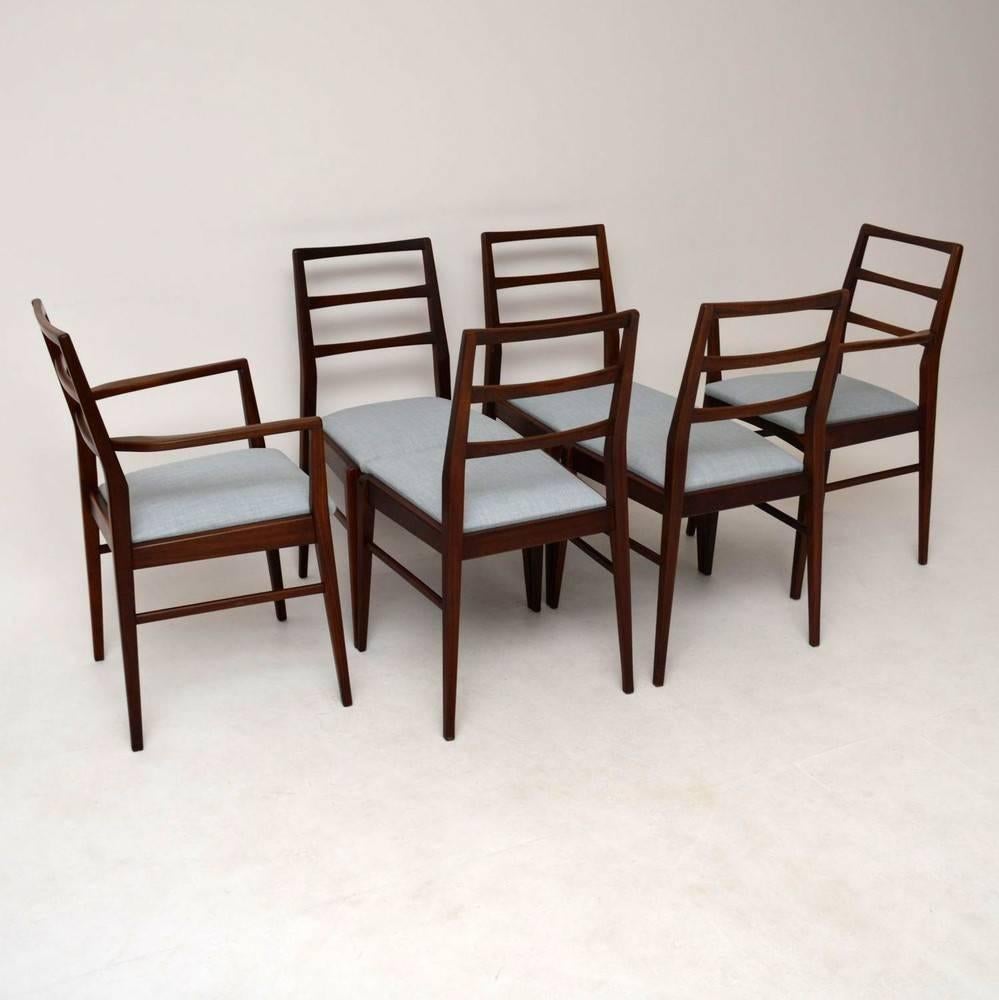 A very stylish and well-made set of solid Afromosia dining chairs, these were designed by Richard Hornby, and they date from the 1950-1960s. They are in excellent condition for their age, all the chairs are sturdy, clean and sound, with only some