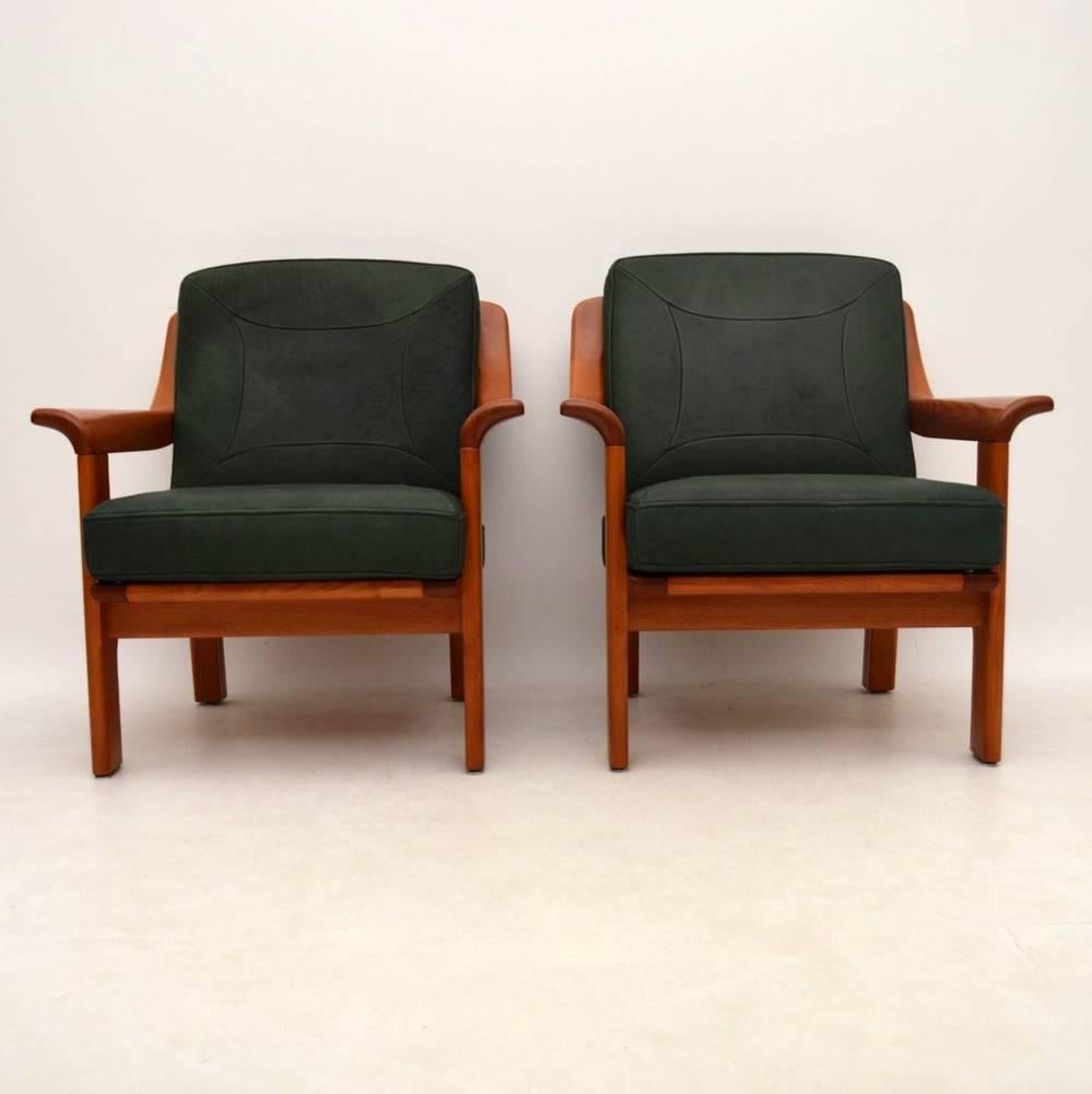 A top quality and very comfortable pair of solid teak and leather armchairs, these were made in Denmark and they date from circa 1970s. They are in superb condition for their age, with only some extremely minor wear here and there. We also have the