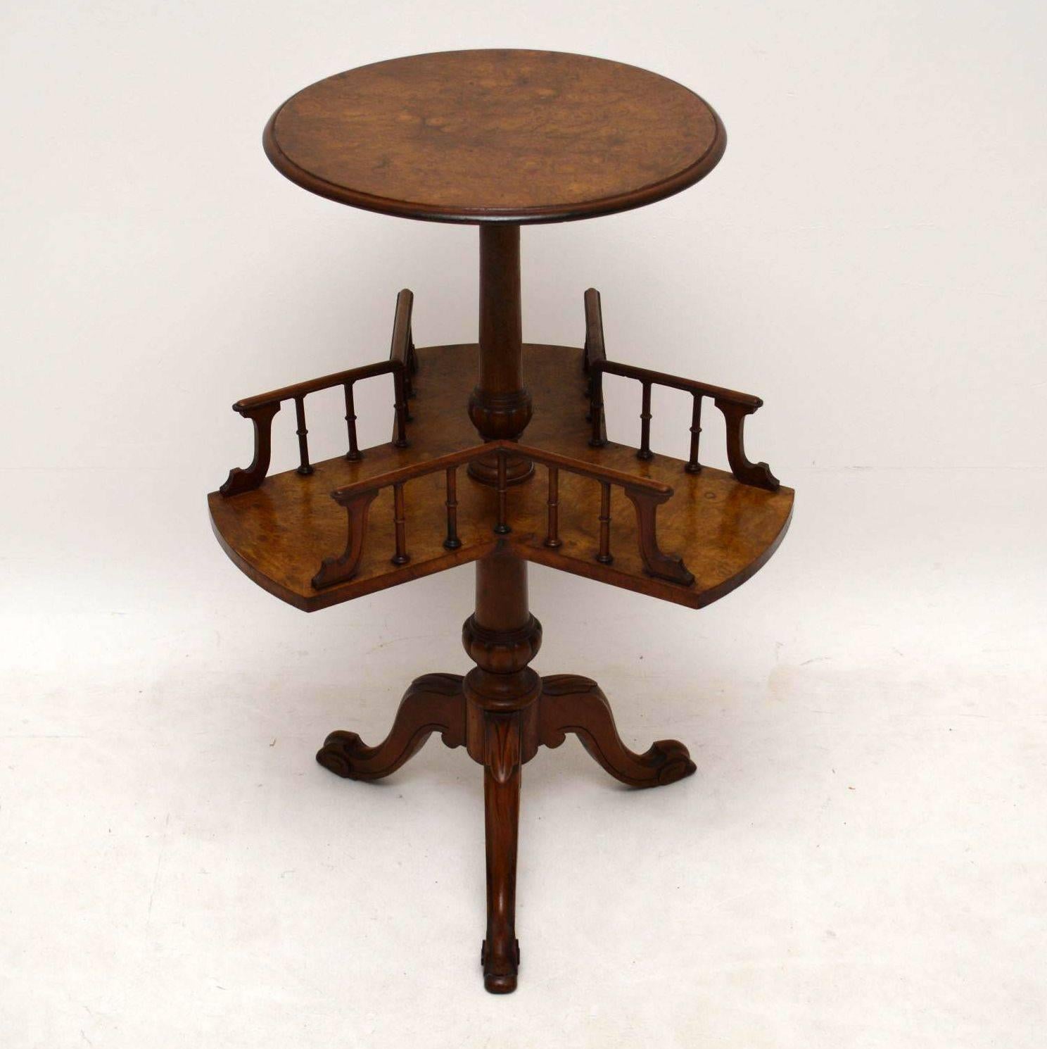 Antique Victorian walnut two-tiered occasional table in good condition dating from circa 1850s-1860s period. It has a burr walnut round top and a spinning burr walnut platform underneath with turned galleries. I think that may have been to put books