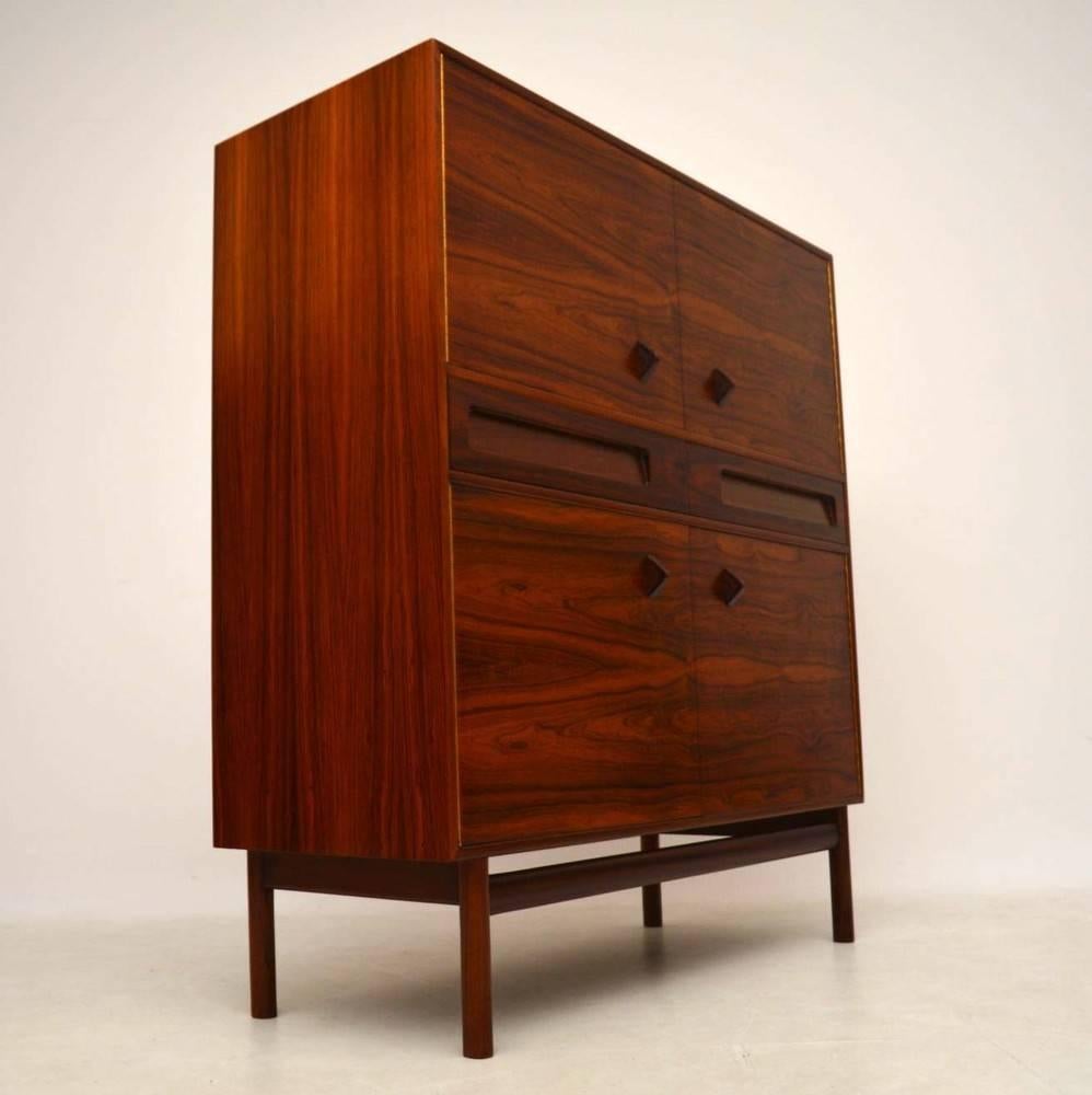 A magnificent rosewood drinks cabinet, this was made by McIntosh in the 1960s. It has amazing grain patterns and a beautiful color, the quality is top notch. We have had this stripped and re-polished to a very high standard, the condition is superb