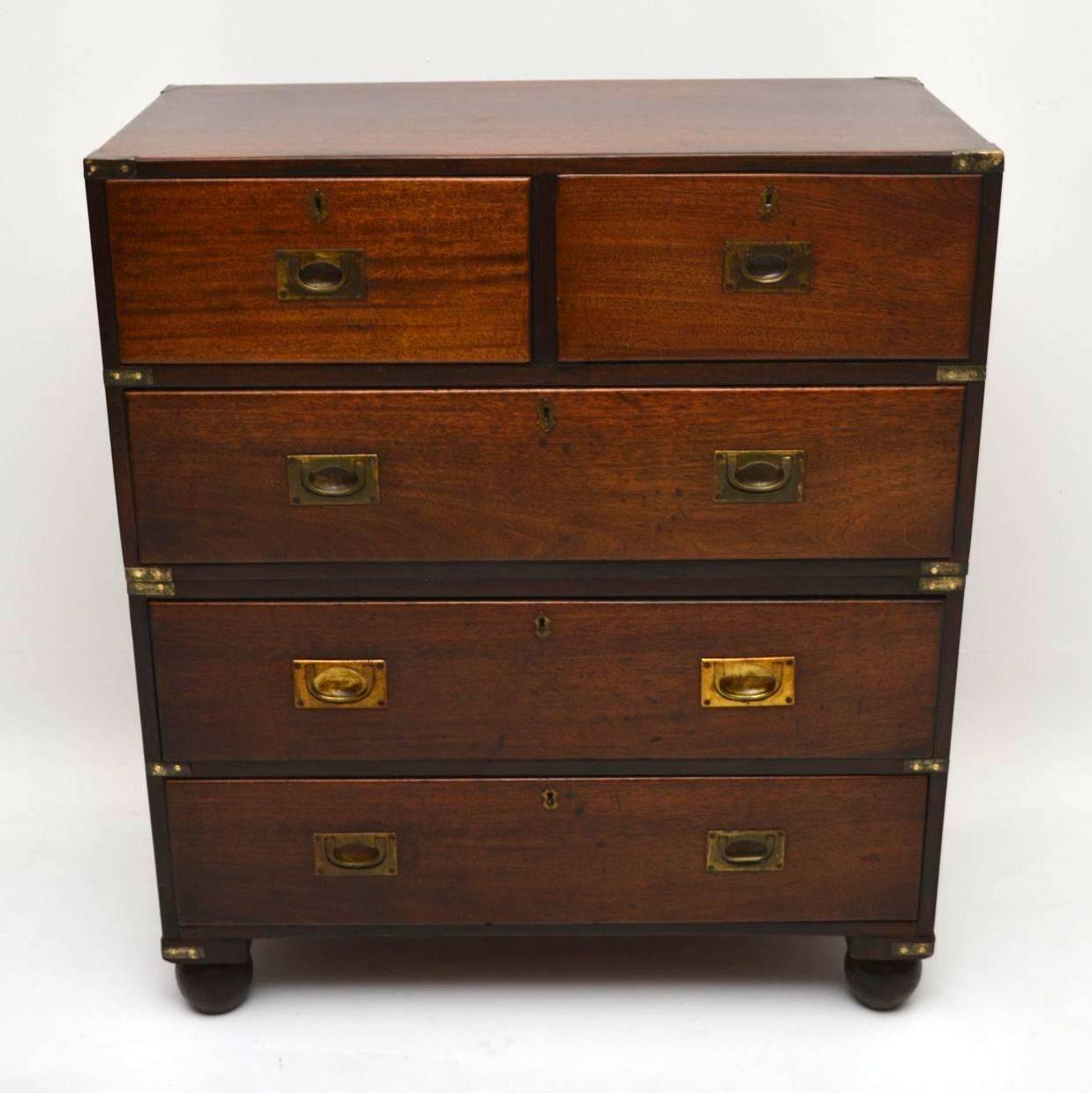 This antique Victorian mahogany Campaign chest of drawers is in good original condition and is full of character. This chest has sunken military brass handles, brass corner fittings and brass carrying handles. The brass fittings are all naturally