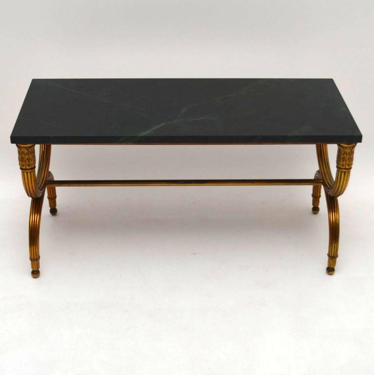 This stylish antique coffee table is of very fine quality and very heavy too for its size. I think its French, made in the 1950-1960s periods and definitely a designer piece. The marble is perfect and even when the marble is taken off, the base is