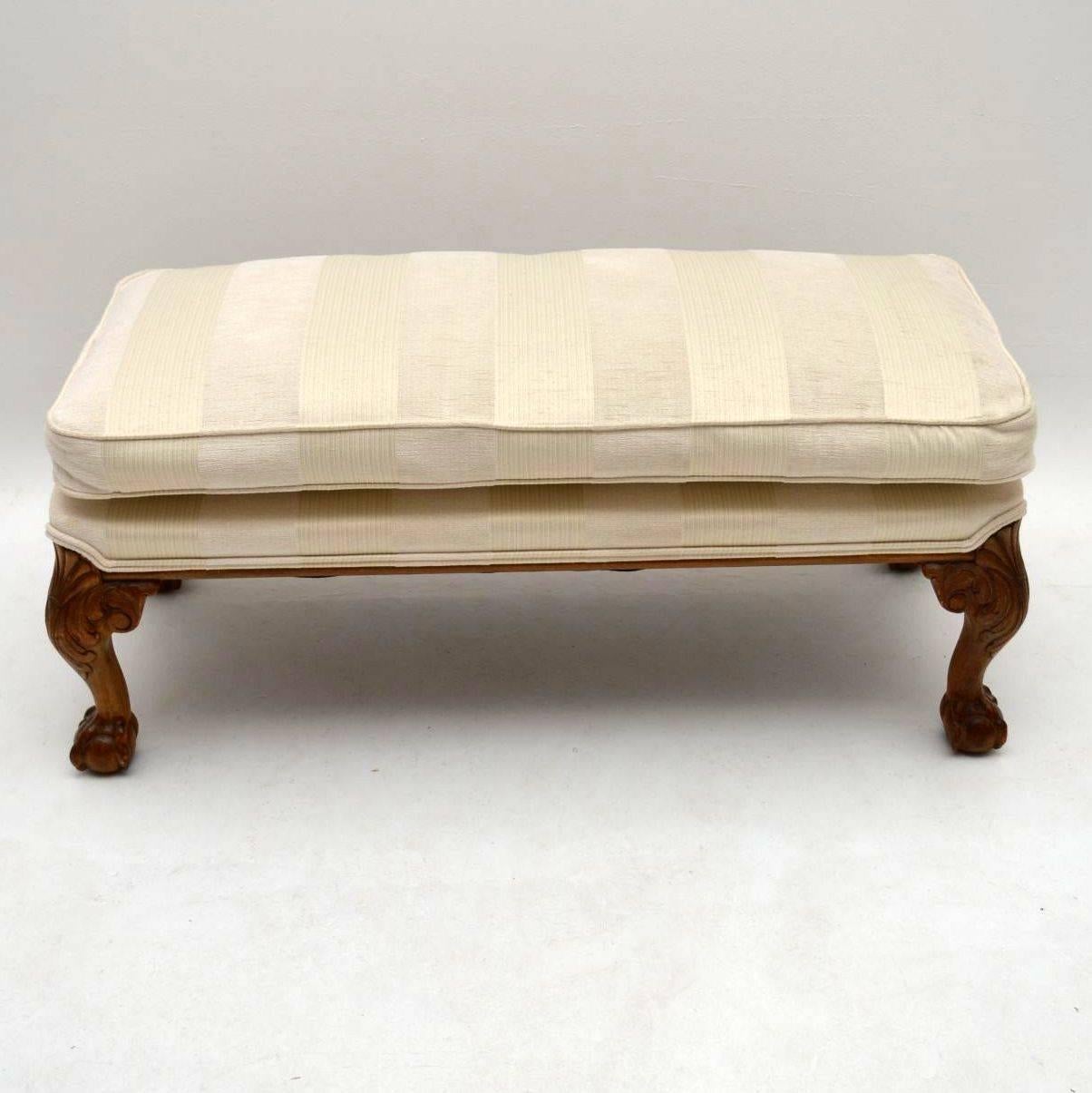 Antique upholstered footstool on hand-carved walnut legs, with shell carvings plus claw and ball feet. This stool has just come out of a private London residence and hasn’t been touched since. The upholstery is excellent condition and was very