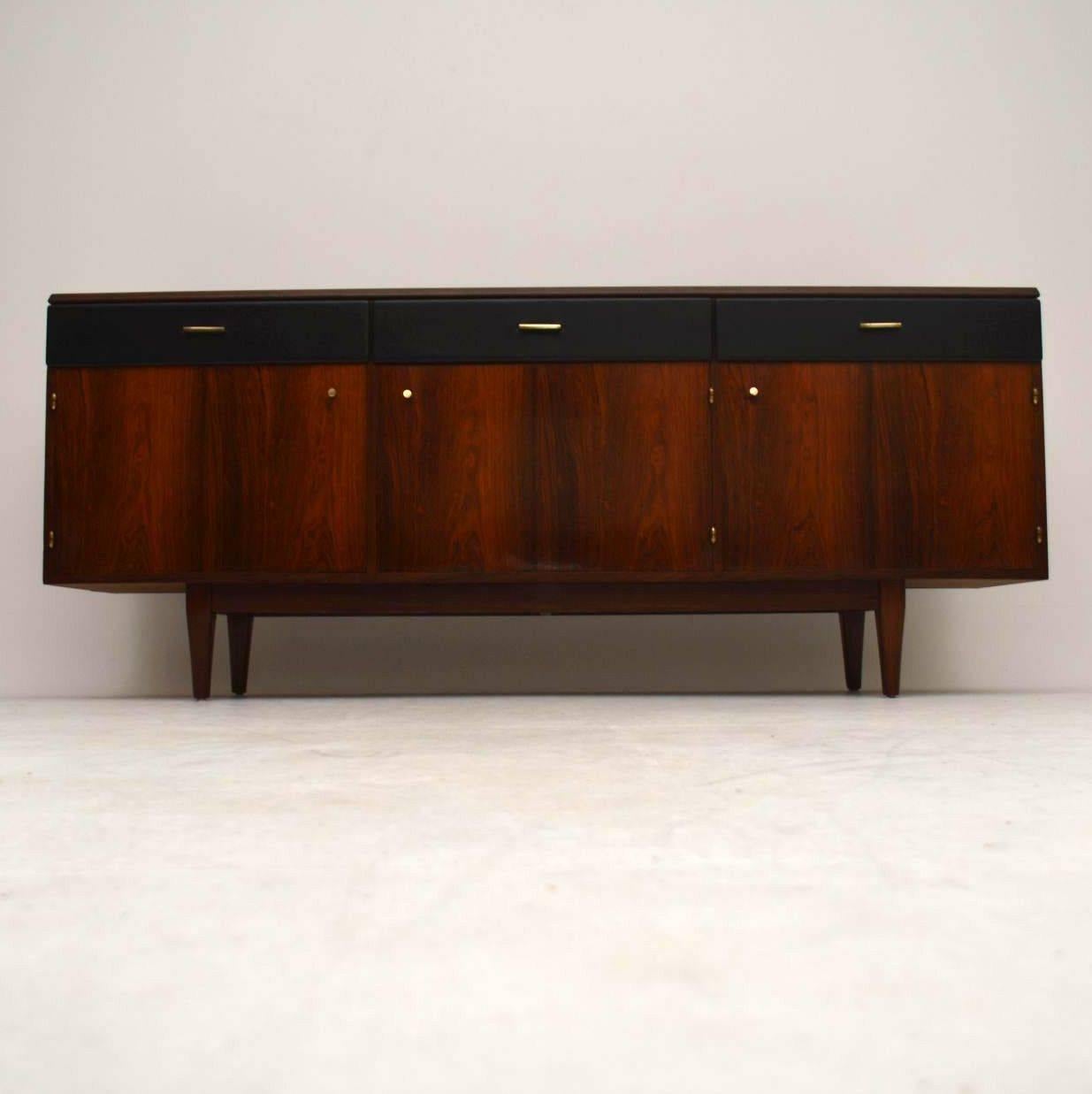 A magnificent rosewood sideboard from the 1960s, this was made by Beresford & Hicks, who were furniture makers by appointment to H.M the Queen. The quality is amazing, it has beautiful rosewood veneers on the inside and out, all built on solid wood,